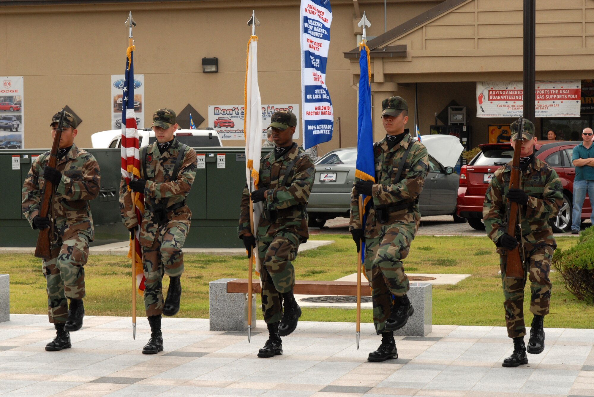 KUNSAN AIR BASE, Republic of Korea -- The 8th Fighter Wing Honor Guard present the colors during a 9/11 ceremony here, Sept. 11 at the base?s Medal of Honor monument.  The remembrance ceremony has been held each year here to honor the fallen in the attacks Sept. 11, 2001. (U.S. Air Force photo/Senior Airman Gustavo Gonzalez)