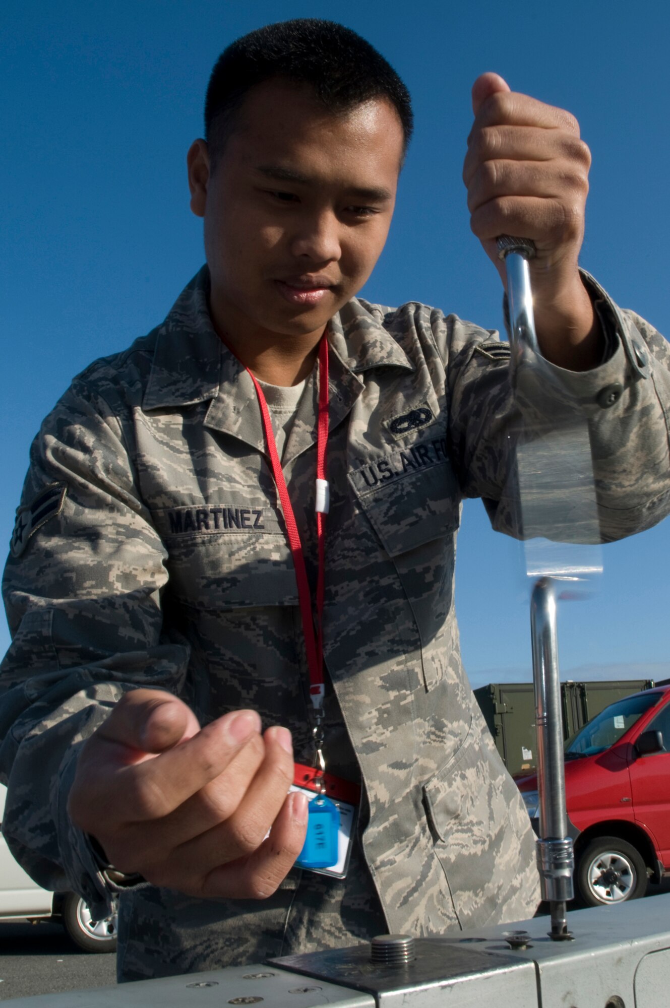 KEFLAVIK AIRPORT, Iceland ? Airman 1st Class Gomes Martinez, an armament team member from the 48th Munitions Squadron, RAF Lakenheath, United Kingdom, unscrews the cover of the forward detent assembly of an LAU-128 Guided Missile Launcher of an F-15 aircraft. His responsibilities include maintaining all of the armament systems on the aircraft. He is participating in Northern Viking 2008, a multinational exercise aimed at exercising the air defense, coastal defense, anti-terror and command and control capabilities of NATO forces in Iceland.  (U.S. Air Force photo by Staff Sgt. Nathan Gallahan.)