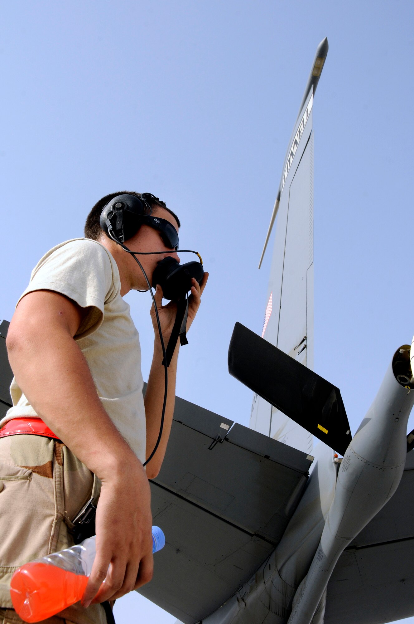 Airman 1st Class Jason Somrak, 379th Expeditionary Aircraft Maintenance Squadron, 340th Aircraft Maintenance Unit, communicates a positive response to flap and stabilizer checks on a KC-135 Stratotanker from the 22nd Air Refueling Wing, McConnell Air Force Base, Kan., as part of pre-flight procedures Sept.9, 2008.  The pre-flight checklist is accomplished before the KC-135 taxies off to start its mission from an undisclosed air base in Southwest Asia.  The KC-135 provides aerial refueling support to Air Force, Navy, Marine Corps and allied nation aircraft engaged in Operations Iraqi and Enduring Freedom and Joint Task Force-Horn of Africa. Airman Somrak, a native of Colfax, La., is deployed from McConnell AFB, Kan. (U.S. Air Force photo by Tech. Sgt. Michael Boquette/Released)