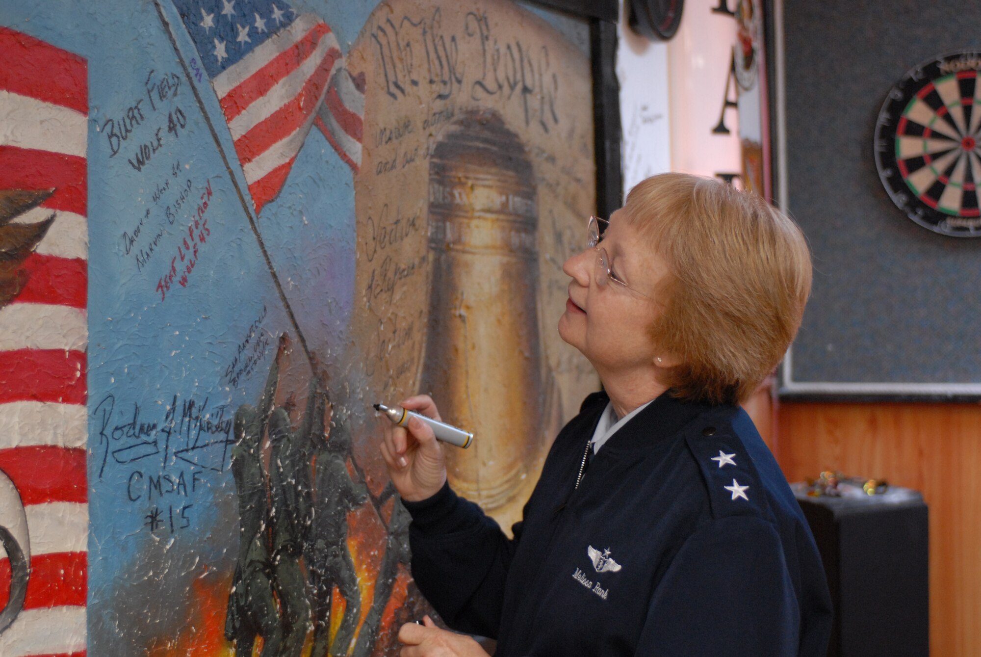 KUNSAN AIR BASE, Republic of Korea --  Major Gen. Melissa Rank, Assistant Air Force Surgeon General, signs a mural at the 8th Medical Group here, Sept. 7. General Rank was visiting for the Asian-Pacific Military Nursing Conference that focused on the military nursing education system and deployments throughout the Pacific. (U.S. Air Force photo/Senior Airman Gustavo Gonzalez) 