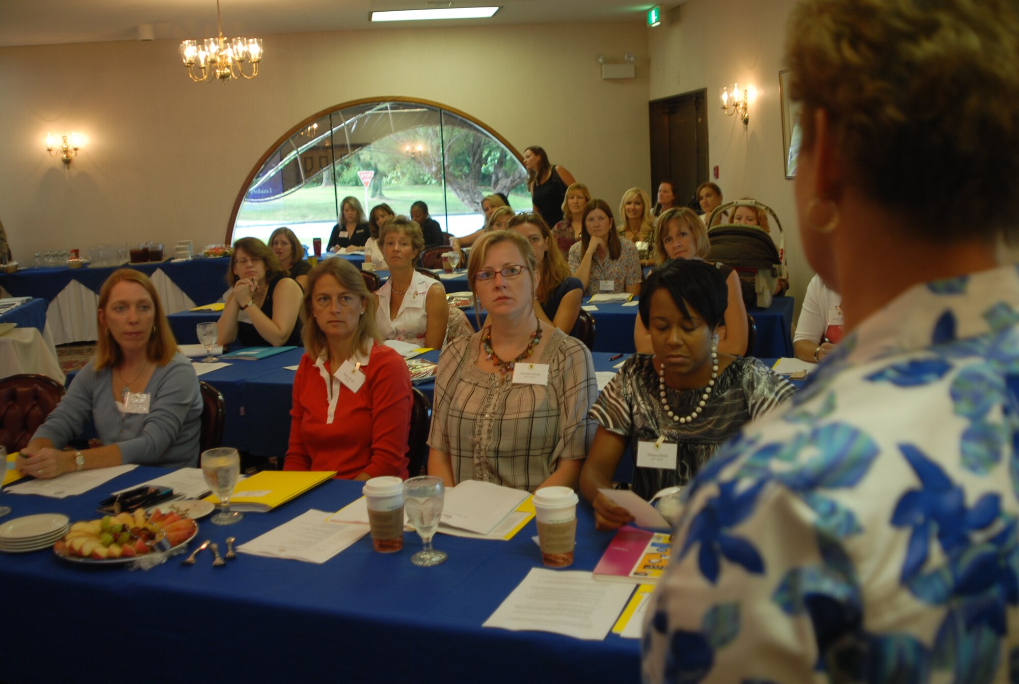 Marianne Williams, wife of Brig. Gen. Brett Williams, 18th Wing commander, welcomes Kadena spouses to the second annual Team Kadena Leadership Spouses Forum Sept. 9. (U.S. Air Force photo/Staff Sgt. Nestor Cruz) 
