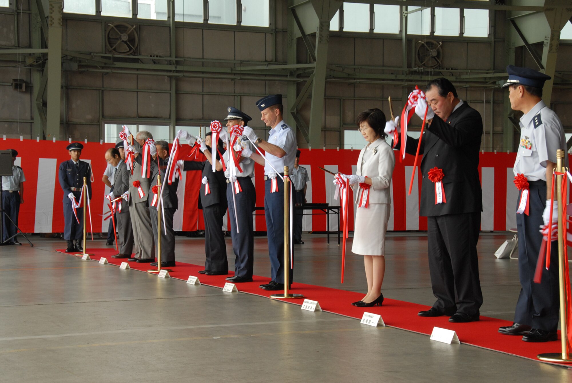 MISAWA AIR BASE, Japan -- Base and community leaders cut the ribbon during the opening ceremony of the Misawa Air Festival Sept. 7, 2008.  The air festival is held annually to strengthen Japanese and American relations.  (U.S. Air Force photo by Airman 1st Class Jamal Sutter)