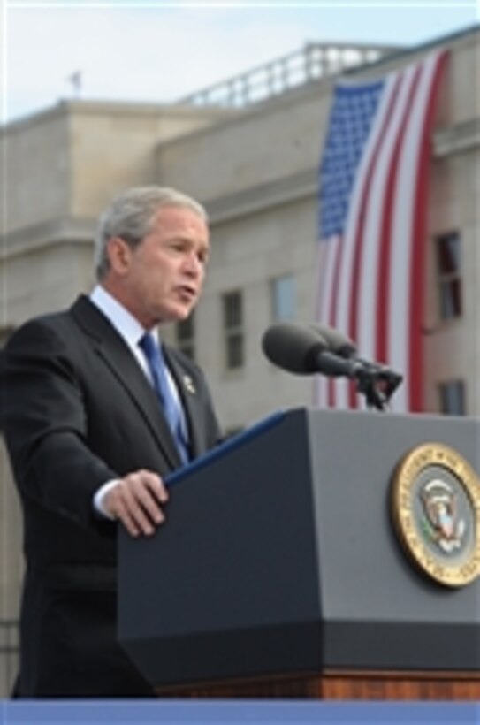 President George W. Bush speaks at the Pentagon Memorial dedication ceremony on Sept. 11, 2008.  The national memorial is the first to be dedicated to those killed at the Pentagon on Sept. 11, 2001.  The site contains 184 inscribed memorial units honoring the 59 people aboard American Airlines Flight 77 and the 125 in the building who lost their lives that day.  