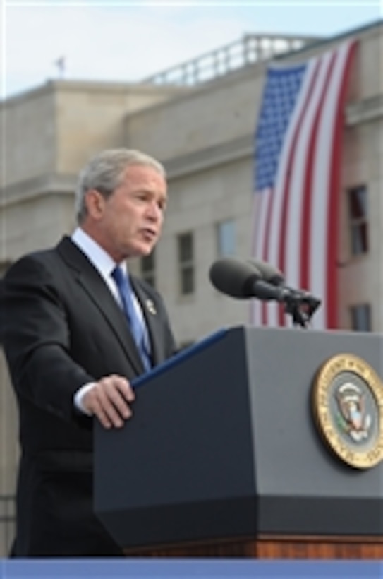 President George W. Bush speaks at the Pentagon Memorial dedication ceremony on Sept. 11, 2008.  The national memorial is the first to be dedicated to those killed at the Pentagon on Sept. 11, 2001.  The site contains 184 inscribed memorial units honoring the 59 people aboard American Airlines Flight 77 and the 125 in the building who lost their lives that day.  