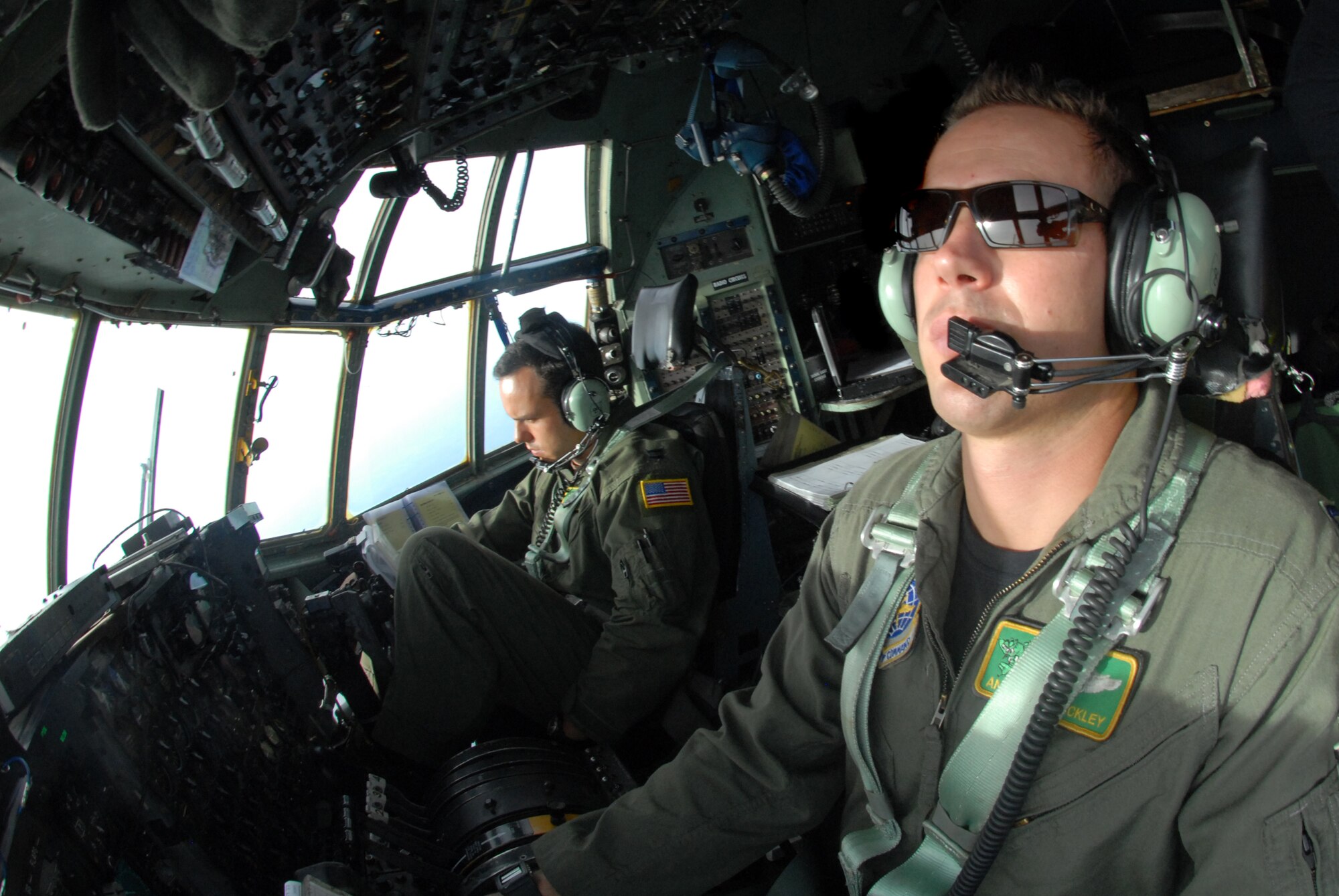 LITTLE ROCK AIR FORCE BASE, Arkansas --. Capt. Anthony Shockley, pilot, Capt. Leonard Livingston, co-pilot, 61st Air Wing, prepare their C-130 aircraft for the arrival back to Little Rock Air Force Base after transporting medical patients from Beaumont, Texas to Lackland Air Force Base, Texas, September 12, 2008.  Little Rock Air Force Base C-130 aircraft and crews are tasked routinely to evacuate possible natural disaster victims to safer locations. (U.S. Air Force photo by Staff Sgt. Chris Willis) (RELEASED)