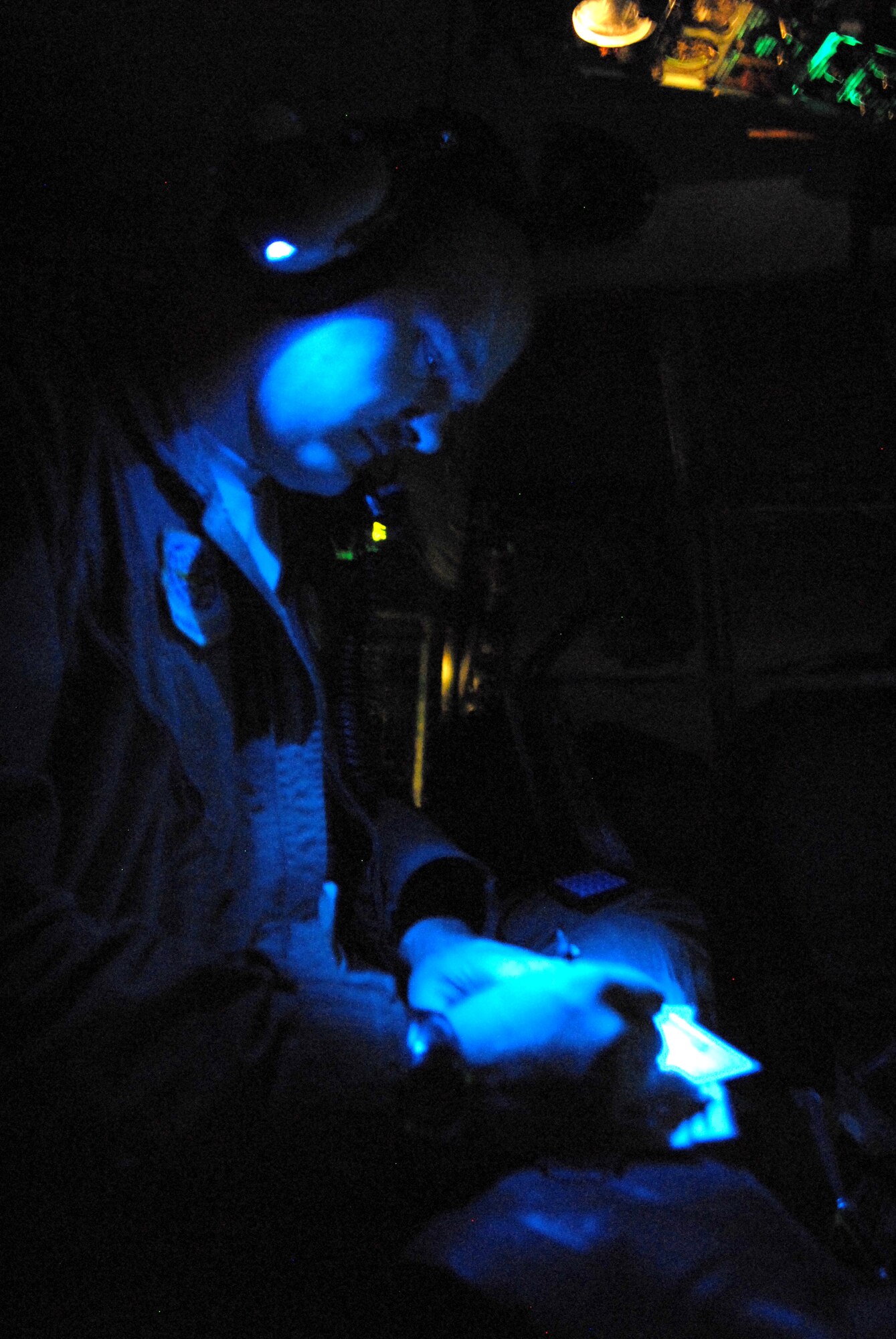 LITTLE ROCK AIR FORCE BASE, Arkansas --. Staff Sgt. Eric Courtemanche, engineer, goes over the take off and landing cards while in route to Beaumont, Texas, September 12, 2008.  Little Rock Air Force Base C-130s were deployed to perform aero medical and transportation missions in preparation for Hurricane Ike's landfall in southern Texas.  (U.S. Air Force photo by Staff Sgt. Chris Willis) (RELEASED)