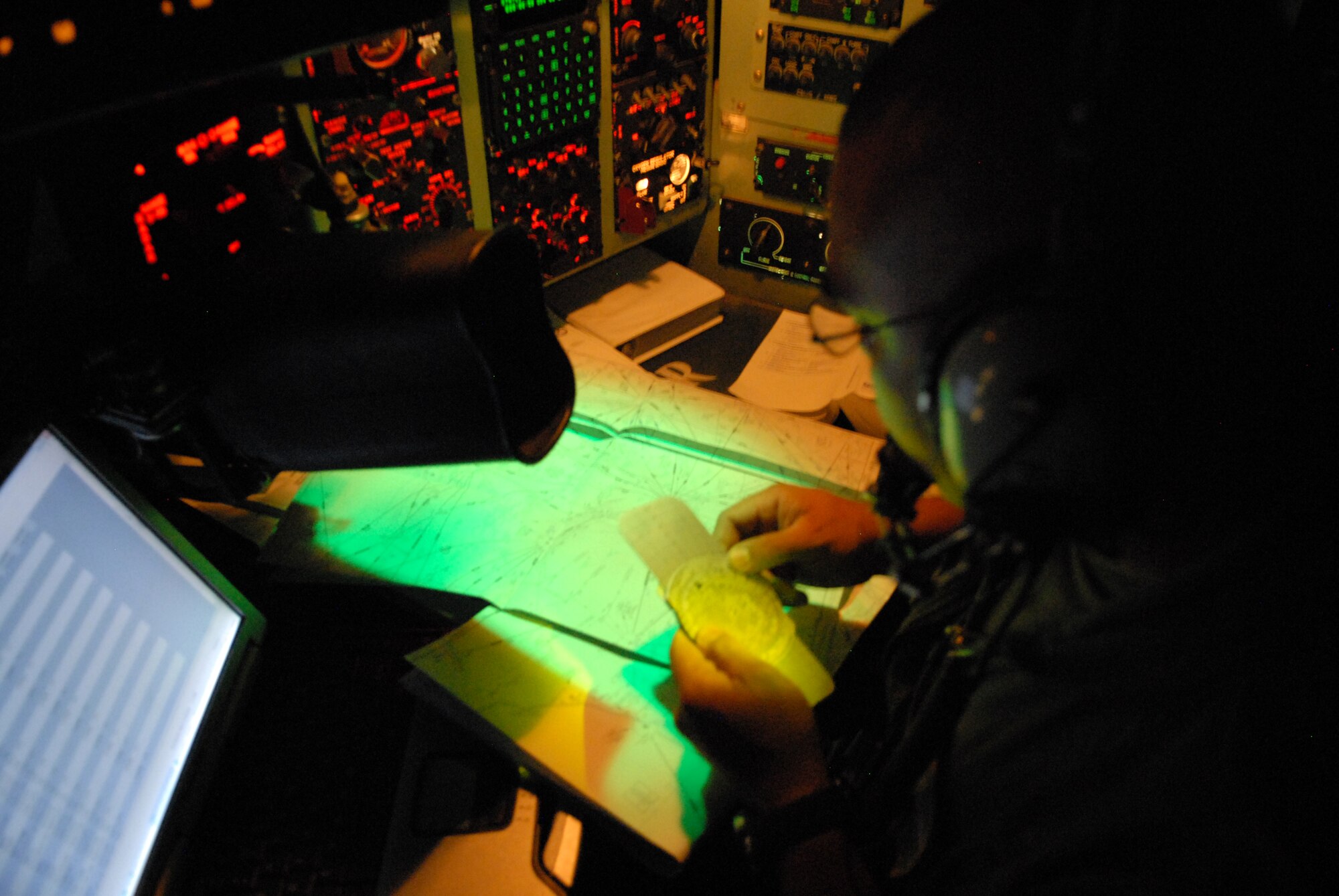 LITTLE ROCK AIR FORCE BASE, Arkansas --. Capt. Ryan David, navigator, 61st Air Wing, calculates the time distance from Beaumont, Texas to Lackland Air Force Base, Texas, September 12, 2008.  Little Rock Air Force Base C-130s were deployed to perform aero medical and transportation missions in preparation for Hurricane Ike's landfall in southern Texas. (U.S. Air Force photo by Staff Sgt. Chris Willis) (RELEASED)