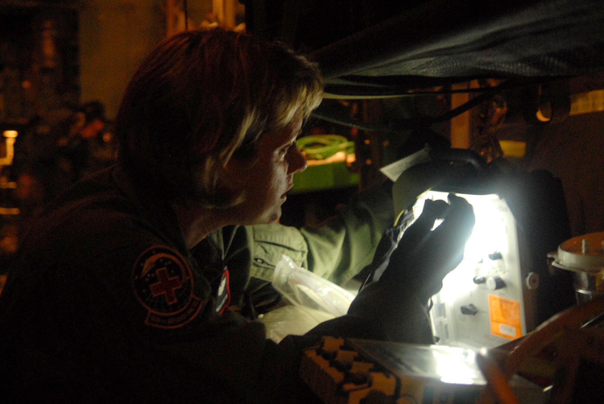 LITTLE ROCK AIR FORCE BASE, Arkansas --.  Senior Airman Melinda Ford goes through pre-flight procedures before takeoff to Beaumont, Texas, September 12, 2008. Patients are being transported from Beaumont, Texas to Lackland Air Force Base, Texas by a combined effort from the 61st Air Wing C-130 aircraft and crews Little Rock Air Force Base and the 908th Aero medical Evacuation Squadron Scott Air Force Base, IL in preparation for Hurricane Ike's landfall in southern Texas.  (U.S. Air Force photo by Staff Sgt. Chris Willis) (RELEASED)