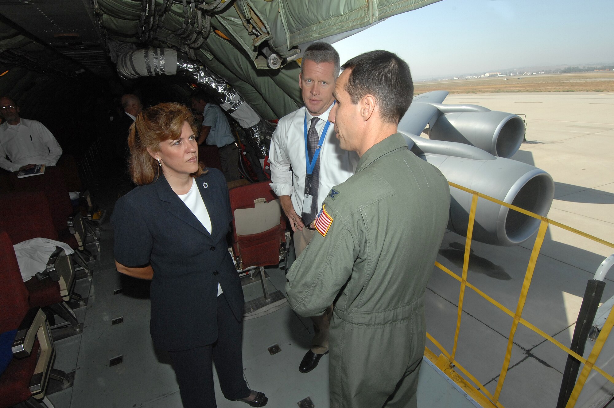 Col. Jeff Pennington, 452nd Operations Group commander (right), discusses the Aug. 28 refueling mission before takeoff with members from the Alternative Fuels Certification Office, Wright-Patterson AFB: Betty Rodriguez, chief engineer and Jeff Braun, director, Alternative Fuels Certification Office, Wright-Patterson AFB. (U.S. Air Force photo by Master Sgt. Rick Sforza, 4th CTCS)