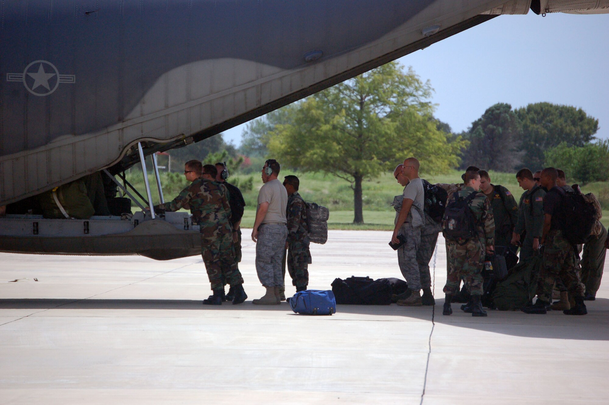 Members of the 331st Air Expeditionary Group unload a C-130 Hercules after landing at Randolph Air Force Base, Texas, Sept. 12. The group, made up of search and rescue personnel and other units from across the Air Force, was staging at the base to provide support in the aftermath of Hurricane Ike. (U.S. Air Force photo/Staff Sgt. Matthew Bates)