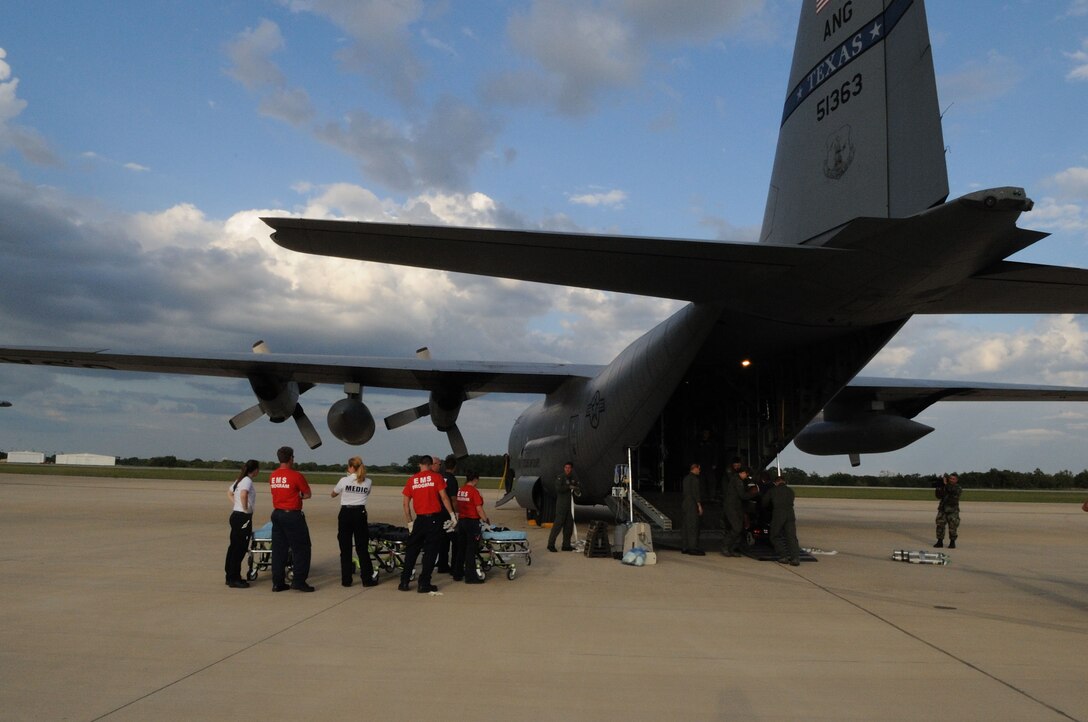 EMS Students from Texas A&M along with local area EMS companies from Bryan-College Station assist in receiving displaced special needs patients from Hurricane Ike. The C-130H from the 136th Airlift Wing, Texas Air National Guard and the 142nd Air Evacuation Squadron, Delaware Air National Guard airlifted special needs patients from Beaumont, Texas on September 11, 2008. (Air Force photo by: SMSgt Elizabeth Gilbert) Cleared