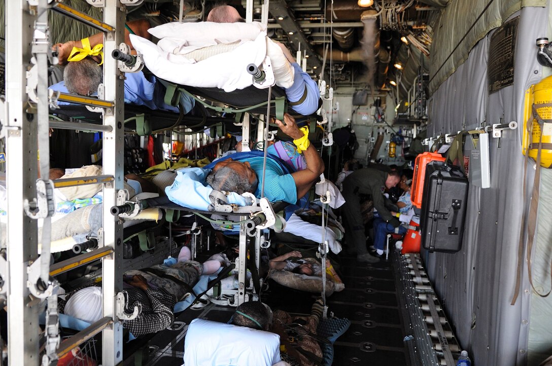 Displaced special needs patients are being evacuated from Beaumont, Texas on-board a Texas Air National Guard C-130H from the 136th Airlift Wing with assistance from the 142nd Air Evacuation Squadron of the Delaware Air National Guard the attending medical team tasked to ensure patient needs in-flight. The patients are being evacuated on September 11, 2008 to Bryan-College Station, Texas to get them out of harms way from  Hurricane Ike.  (Air Force photo by: SMSgt Elizabeth Gilbert)  Cleared