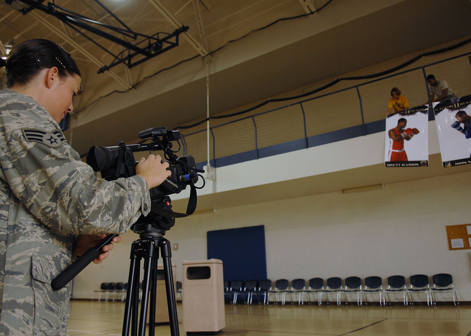 Senior Airman Katerina Slivinske, 49th Fighter Wing, Public Affairs, documents the volunteer set up at the gym in preparation for "Raptor Rumble 2," Sept 12. Raptor Rumble is the annual boxing event held at Holloman for Air Force Service members to participate in amateur boxing. The Raptor Rumble event will be held at the Fitness Center.

(U.S. Air Force photo/ Senior Airman Anthony Nelson)
