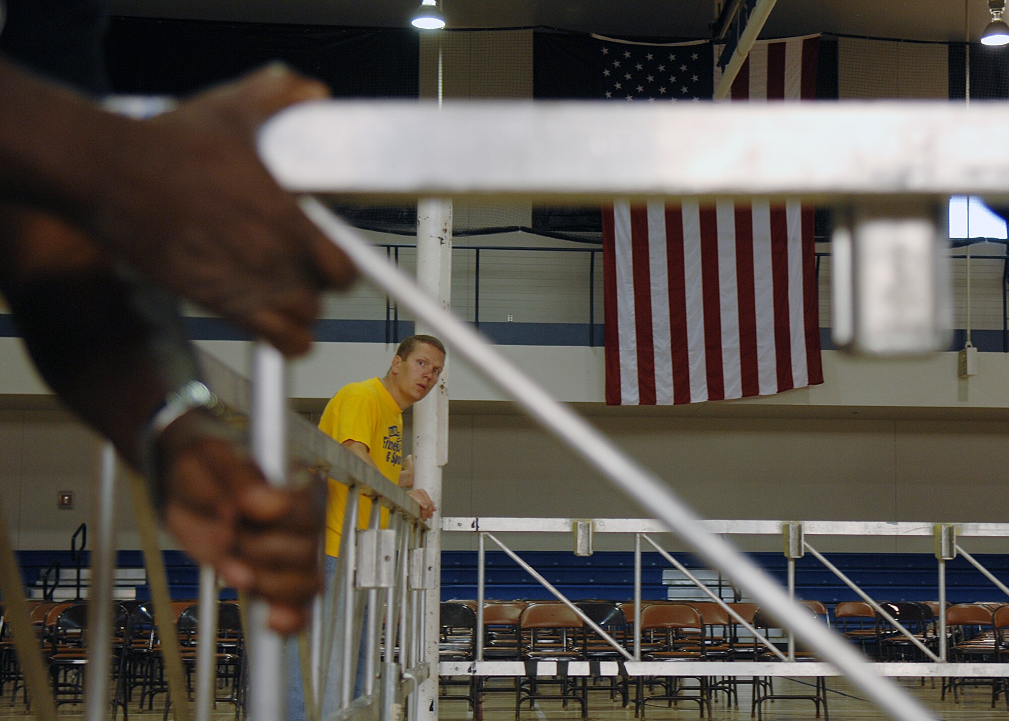 Senior Airman Jason Daffern, 49th Force Support Squadron, helps set up the boxing ring for "Raptor Rumble 2," Sept 12. Raptor Rumble is an annual boxing event held at Holloman for Air Force Service members to participate in amateur boxing. The Raptor Rumble event will be held at the Fitness Center.

(U.S. Air Force photo/ Senior Airman Anthony Nelson)
