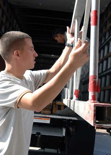 Airman 1st Class William Schull, 49th Communications Squadron, helps unload and set up the boxing ring for "Raptor Rumble 2," Sept 12. Raptor Rumble is an annual boxing event held at Holloman for Air Force Service members to participate in amateur boxing. (U.S. Air Force photo/ Senior Airman Anthony Nelson)