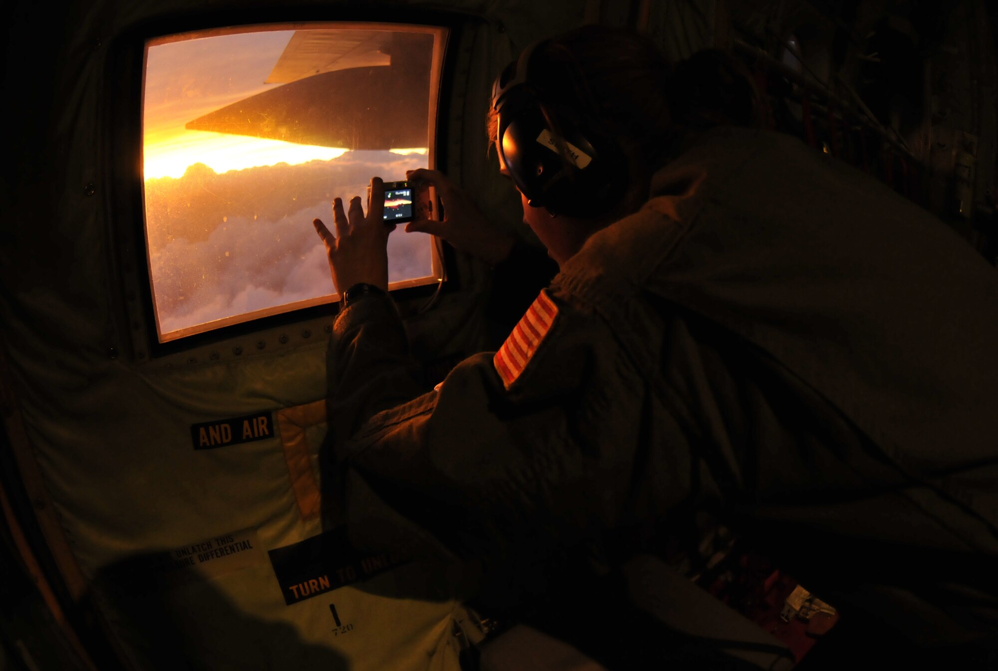 Even bad weather can sometimes be beautiful. Staff Sgt. Shannon Smith, weather reconnaissance loadmaster, takes a photo of a spectacular sunset after flying a mission into Hurricane Ike. (U.S. Air Force Photo/Tech. Sgt. James B. Pritchett)