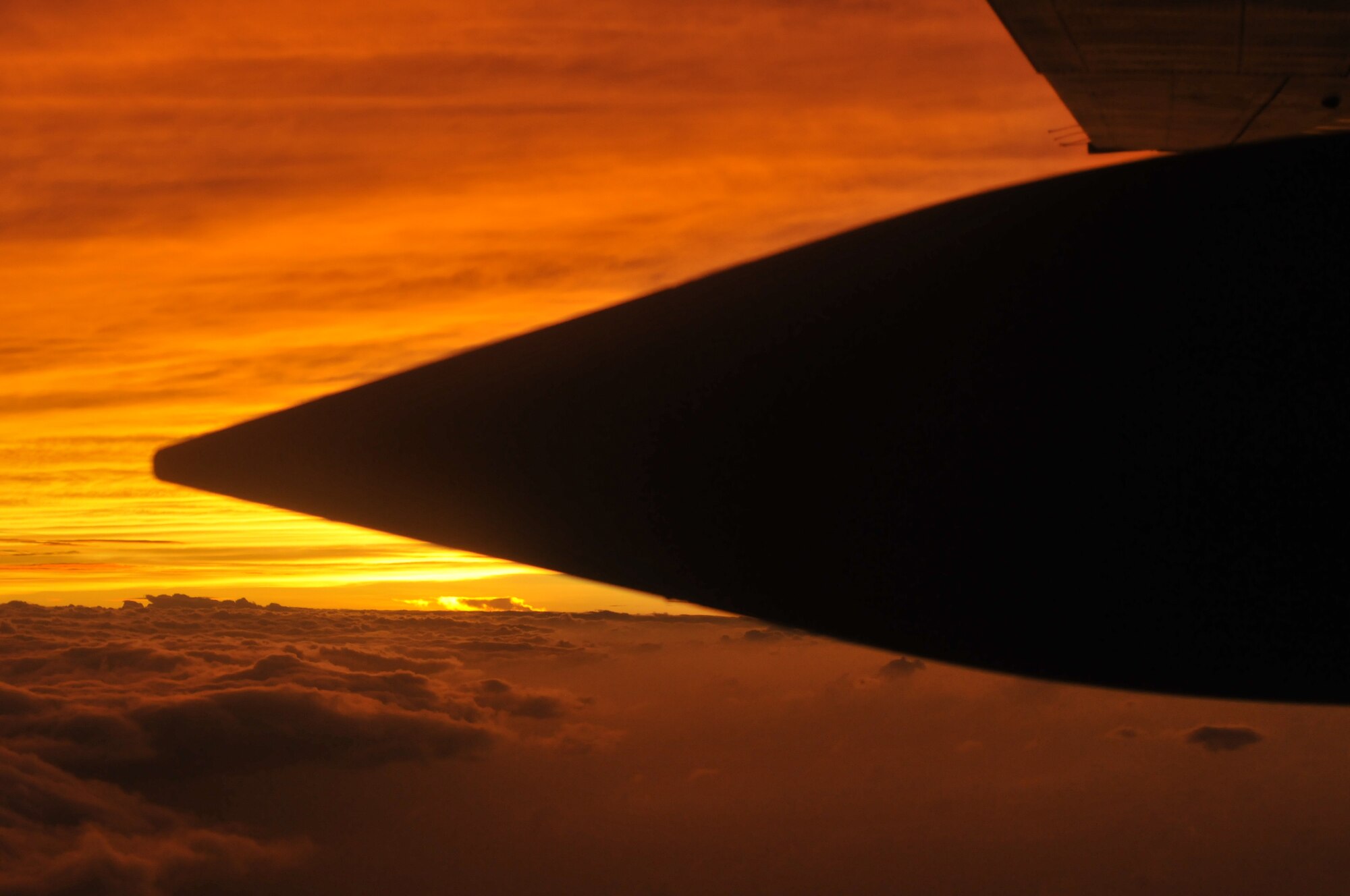 At the end of the day, the sun sets as this WC-130J Hurricane Hunter aircraft makes its way back to its home at Keesler Air Force Base, Miss. after flying into Hurricane Ike. The Hurricane Hunters of the 53rd Weather Reconnaissance Squadron are one of two flying squadrons assigned to Air Force Reserve Command's 403rd Wing.  The Hunter's sister squadron, the 815th Airlift Squadron have been called on to support releif efforts after the storm.  (U.S. Air Force Photo/Tech. Sgt. James B. Pritchett)