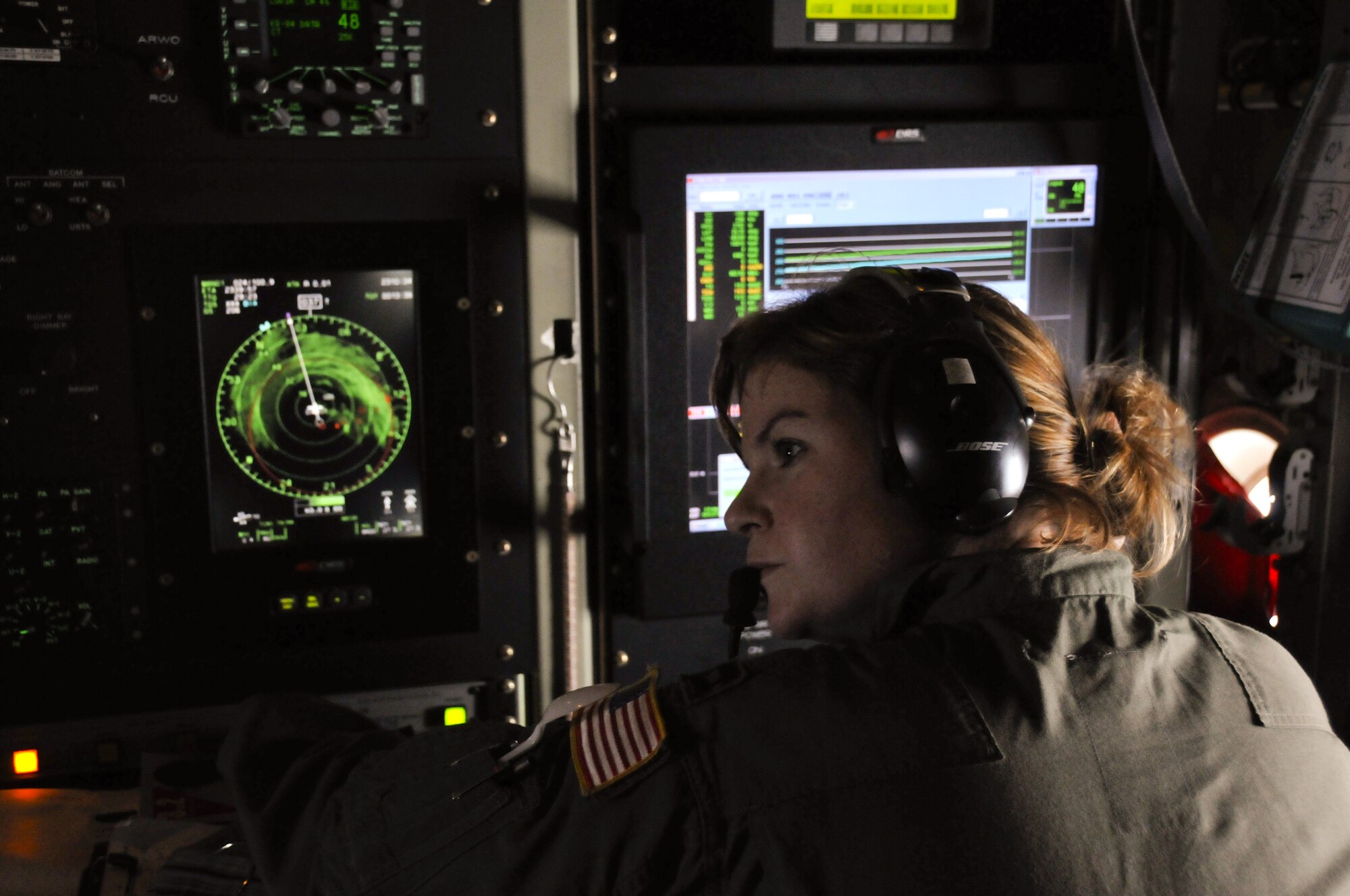 Directing the flight into Hurricane Ike, Capt. Kaitlyn McLaughlin, aerial reconnaissance weather officer, works closely with the National Hurricane Center as well as coordinating on the aircraft with pilots and the navigator aboard the WC-130J Hurricane Hunter aircraft. (U.S. Air Force Photo/Tech. Sgt. James B. Pritchett)