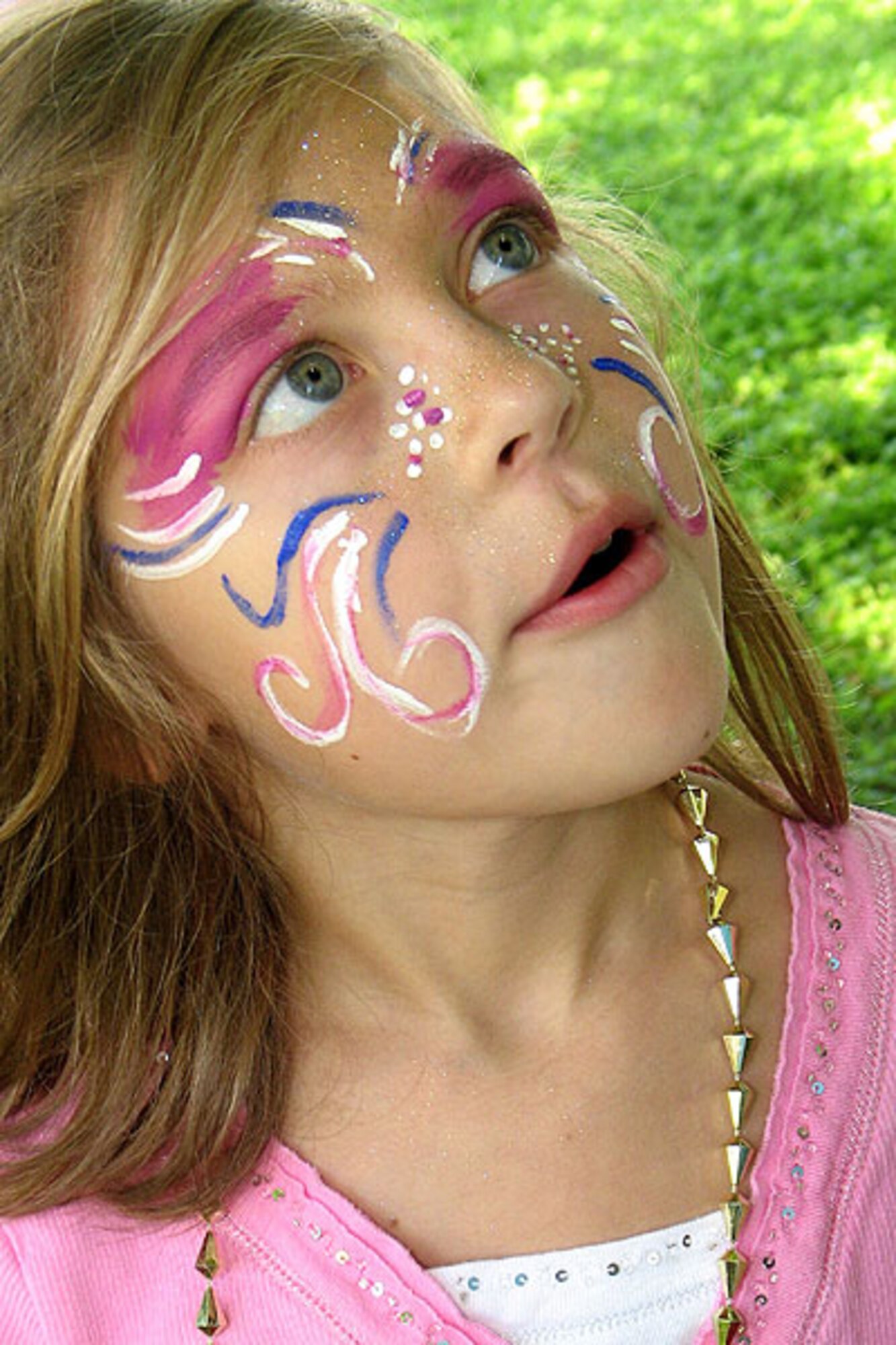 LAUGHLIN AIR FORCE BASE, Texas – Adriann Loftus displays her painted face at the 47th Flying Training Wing Friendship Chapel’s Renaissance Fair.  More than 400 people attended the event Sept. 6.  The festival featured a dunking booth, bounce castle and human chess match, among other attractions.  (U.S. Air Force photo by David Loftus.)