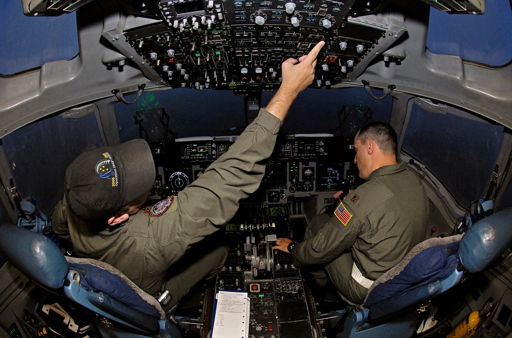 Maj. Corey Simmons and Maj. Eric Von Trotha perform preflight procedures on a C-17 Globemaster III Sept. 10 at Christchurch International Airport, New Zealand. The aircrew took approximately 60,000 pounds of supplies to Antarctica as part of Joint Task Force Support Forces Antarctica, headquartered at Hickam Air Force Base, Hawaii, and led by 13th Air Force. The joint task force is currently conducting Operation Deep Freeze in support of the National Science Foundation and U.S. Antarctic Program. Major Simmons is an active duty evaluator pilot with the 62nd Operations Support Squadron at McChord AFB, Wash., and Major Von Trotha is a Reserve evaluator pilot with the 313th Airlift Squadron, also at McChord AFB. (U.S. Air Force photo/Master Sgt. Chris Vadnais) 

