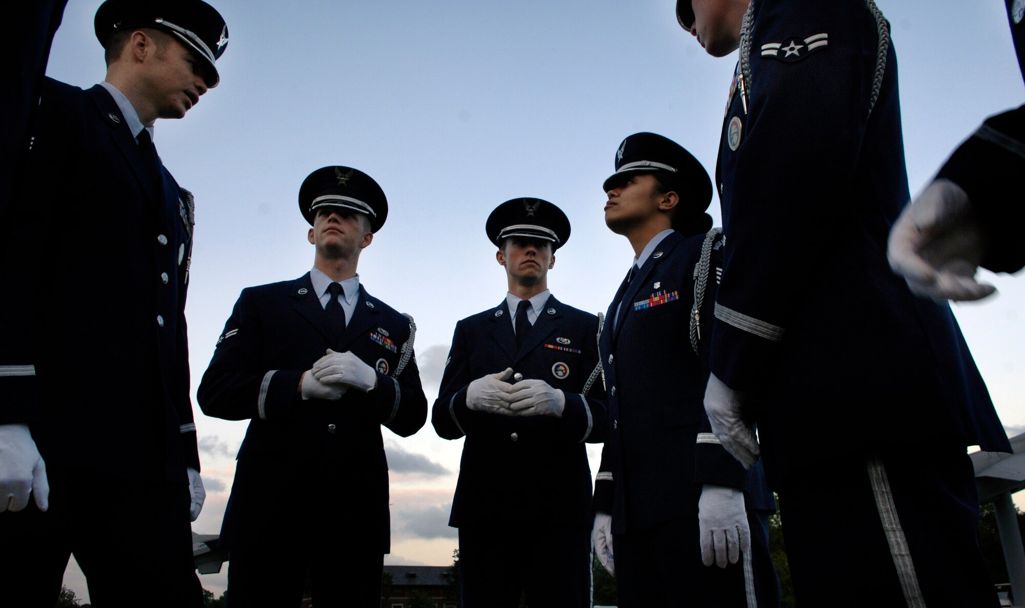 LANGLEY AIR FORCE BASE, Va. -- Members of the Honor Guard discuss the detail before the Air Combat Command Tattoo ceremony at Memorial Park Sept. 11.   The ACC Tattoo tribute is a 75-minute production that  honors America's Airmen, both past and present.  (U.S. Air Force photo/Senior Airman Vernon Young)