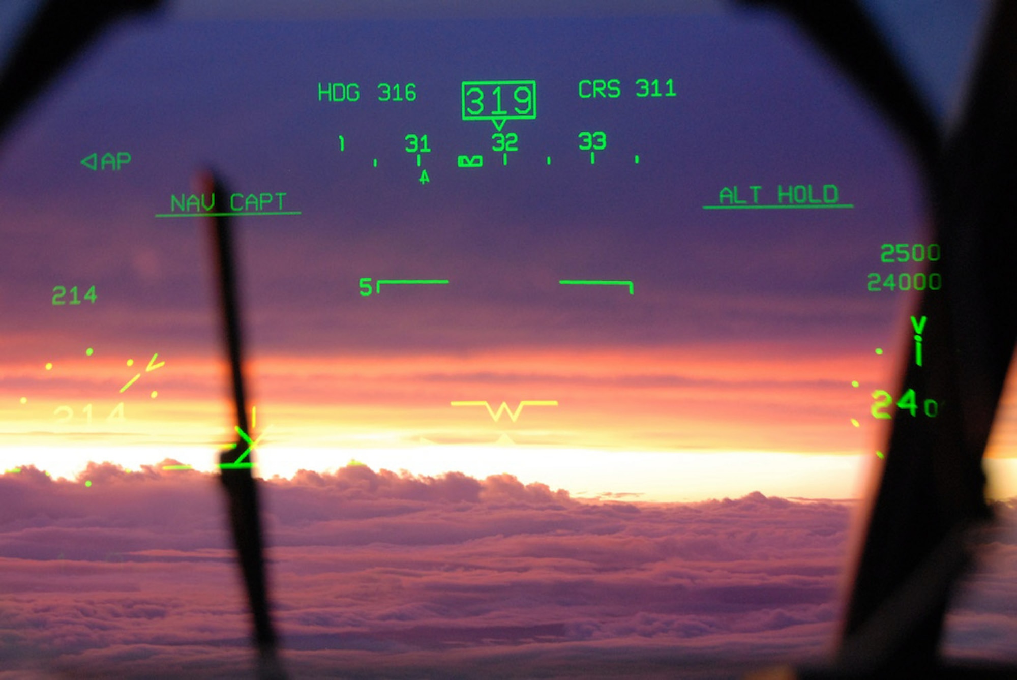 A pilot's view of sunset through the heads-up display after flying into Hurricane Ike Sept. 10 over the Gulf of Mexico. The Air Force Reserve Hurricane Hunters of the 403rd Wing at Keesler Air Force Base, Miss, fly 24-hours-a-day, collecting data inside the heart of Hurricane Ike. The data collected by the Hurricane Hunters improve the National Hurricane Center forecast by 30 percent. (U.S. Air Force photo/Maj. Chad E. Gibson) 
