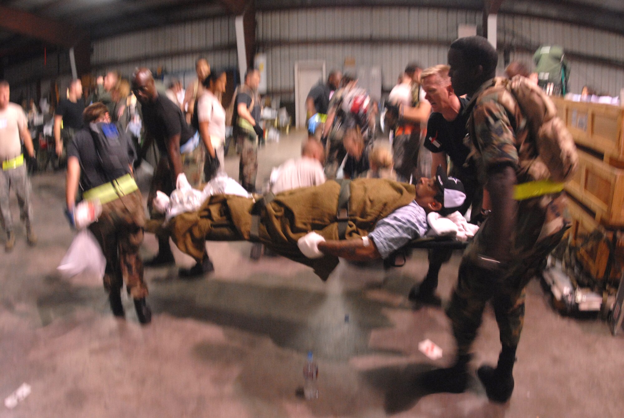 CORPUS CHRISTI INTERNATIONAL AIRPORT, Texas -- U.S. Air Force Airmen transport a patient, September 11, 2008. Military members are tasked routinely to evacuate possible natural disaster victims to safer locations. (U.S. Air Force photo by Airman 1st Class Steele Britton) (RELEASED) 