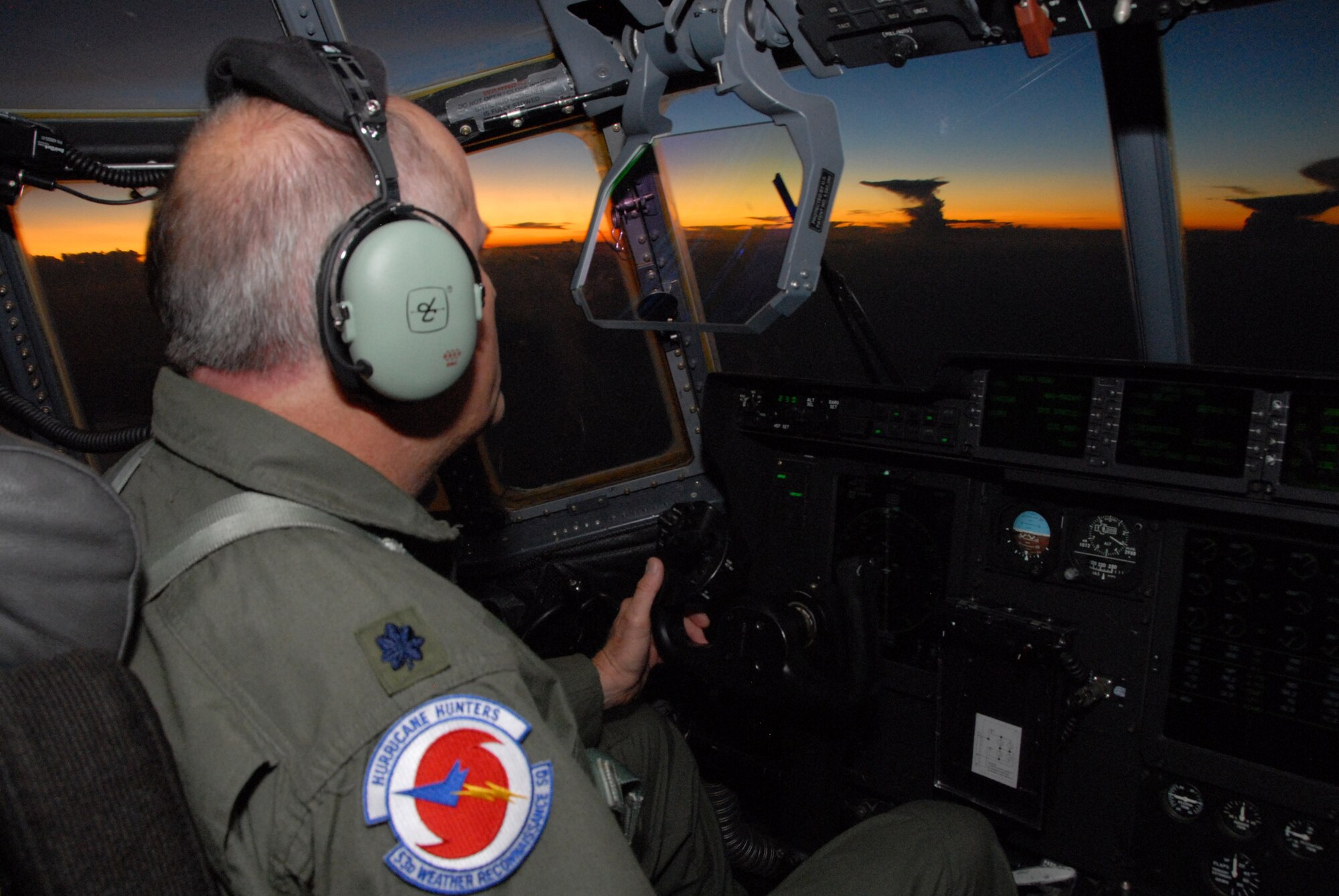 Lt. Col. Mark Carter views thunderstorms and sunset through the heads-up display of the WC-130J Hercules after collecting Hurricane Ike data Sept. 10 over the Gulf of Mexico. The flight lasted more than nine hours and helped improve the National Hurricane Center forecast by 30 percent. Colonel Carter is a pilot with the 403rd Wing. (U.S. Air Force photo/Maj. Chad E. Gibson) 
