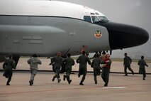 OFFUTT AIR FORCE BASE, Neb. -- Aircrew members from the 55th Wing scramble to their RC-135 during an alert exercise Aug. 21, 2008. (U.S. Air Force Photo/Josh Plueger)