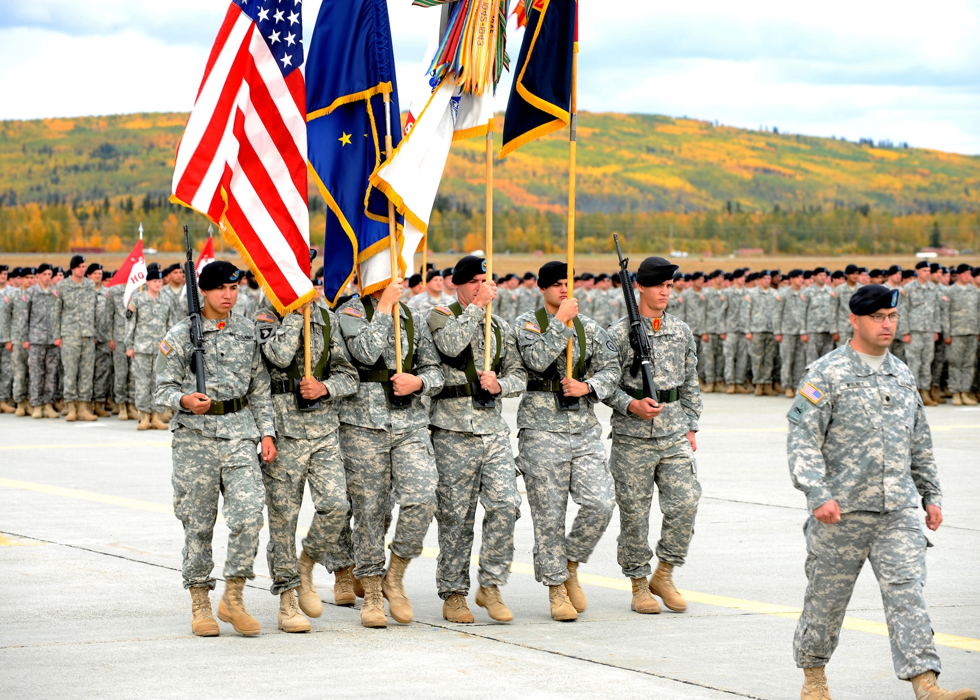 Honor Guard for the 1st Stryker Brigade Combat Team, 25th Infantry Division, prepares to case the colors Sept. 10, 2008, at Fort Wainwright. The casing of the colors is part of a deployment ceremony; the colors will be uncased at a separate ceremony upon arriving in Iraq later this month. (U.S. Air Force photo by Airman 1st Class Willard E. Grande)
