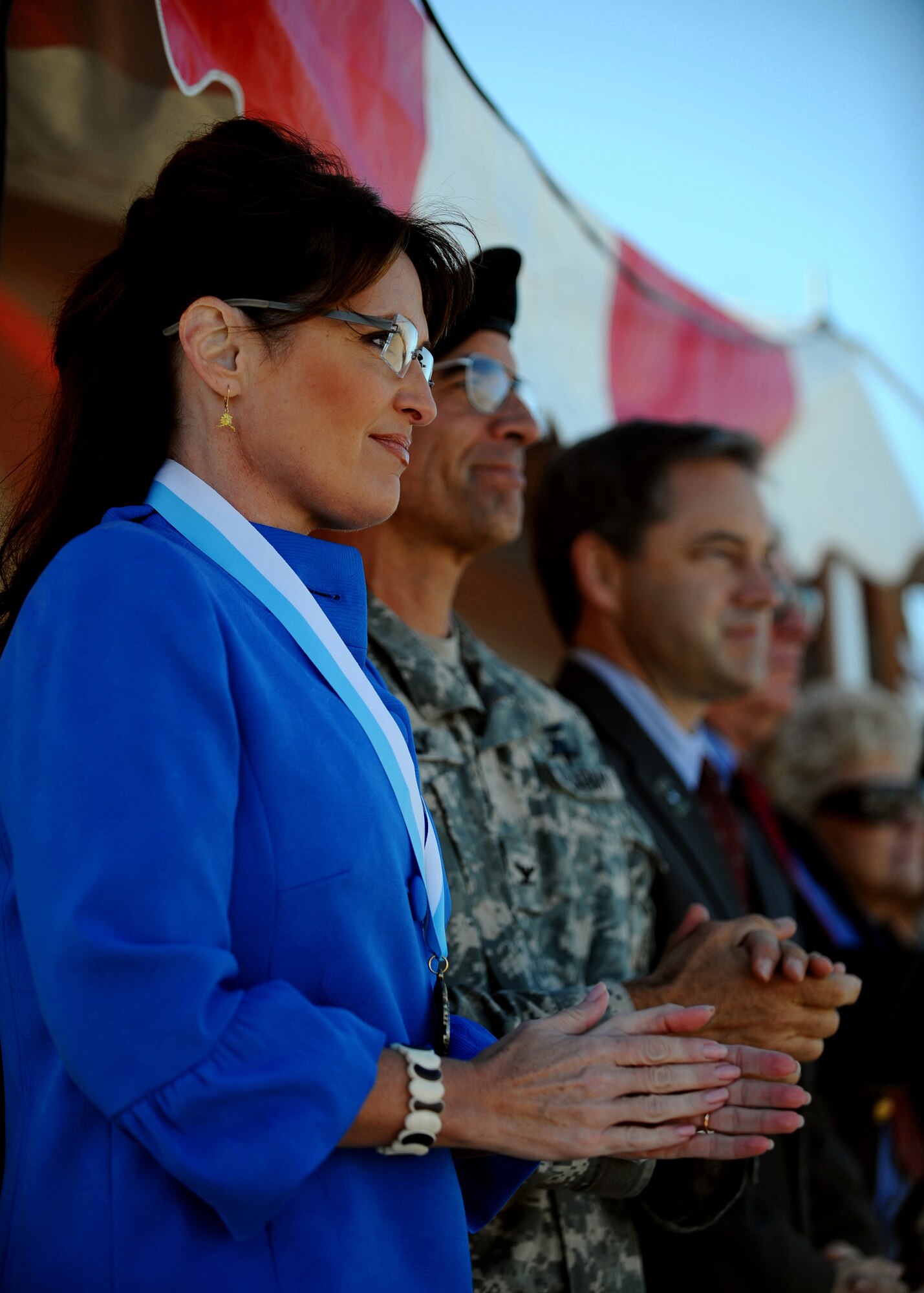 Alaska Governor Sarah Palin applauds for the 1st Stryker Brigade Combat Team, 25th Infantry Division in their deployment ceremony Sept. 10, 2008. Gov. Palins' son is one of the Soldiers deploying. (U.S. Air Force photo by Airman 1st Class Willard E. Grande)