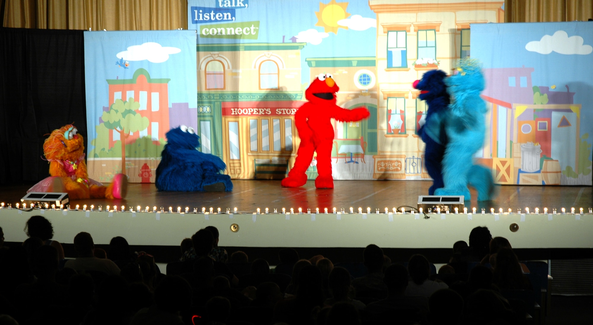 EGLIN AIR FORCE BASE, Fla. -- Sesame Street characters perform live at the base theater for more than 490 families as part of The Sesame Street Experience for Military Families tour Sept 11. Sesame Workshop and the United Service Organizations partnered to bring the free 25-min show to more than 40 military installations across the United States as part of Sesame?s military outreach program Talk, Listen, Connect. (U.S. Air Force photo/Capt. Carrie L. Kessler)