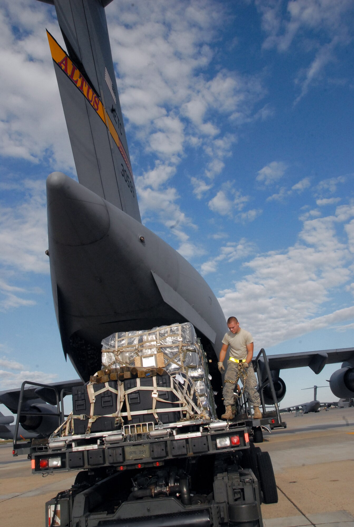 Airman 1st Class Gregory S. Reno assists in loading a C-17 Globemaster III Sept. 10 at Kelly Field, Texas. The cargo will be used for emergency response and contingencies related to Hurricane Ike. The supplies were flown to Harlingen, Texas, by a crew assigned to the 58th Airlift Squadron from Altus Air Force Base, Okla. Airman Reno is from the 305th Aerial Port Squadron, McGuire AFB, N.J. (U.S. Air Force photo/Airman 1st Class Cherice Bryant) 
