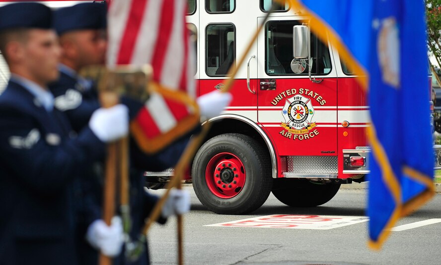 MOODY AIR FORCE BASE, Ga. -- Airmen of the 23rd Wing Honor Guard present the colors during a September 11 memorial ceremony held at the 23rd Civil Engineer Squadron fire department here Sep. 11. The ceremony was held to honor those who passed away due to the tragic events of September 11, 2001. (U.S. Air Force photo by Senior Airman Elizabeth Rissmiller)