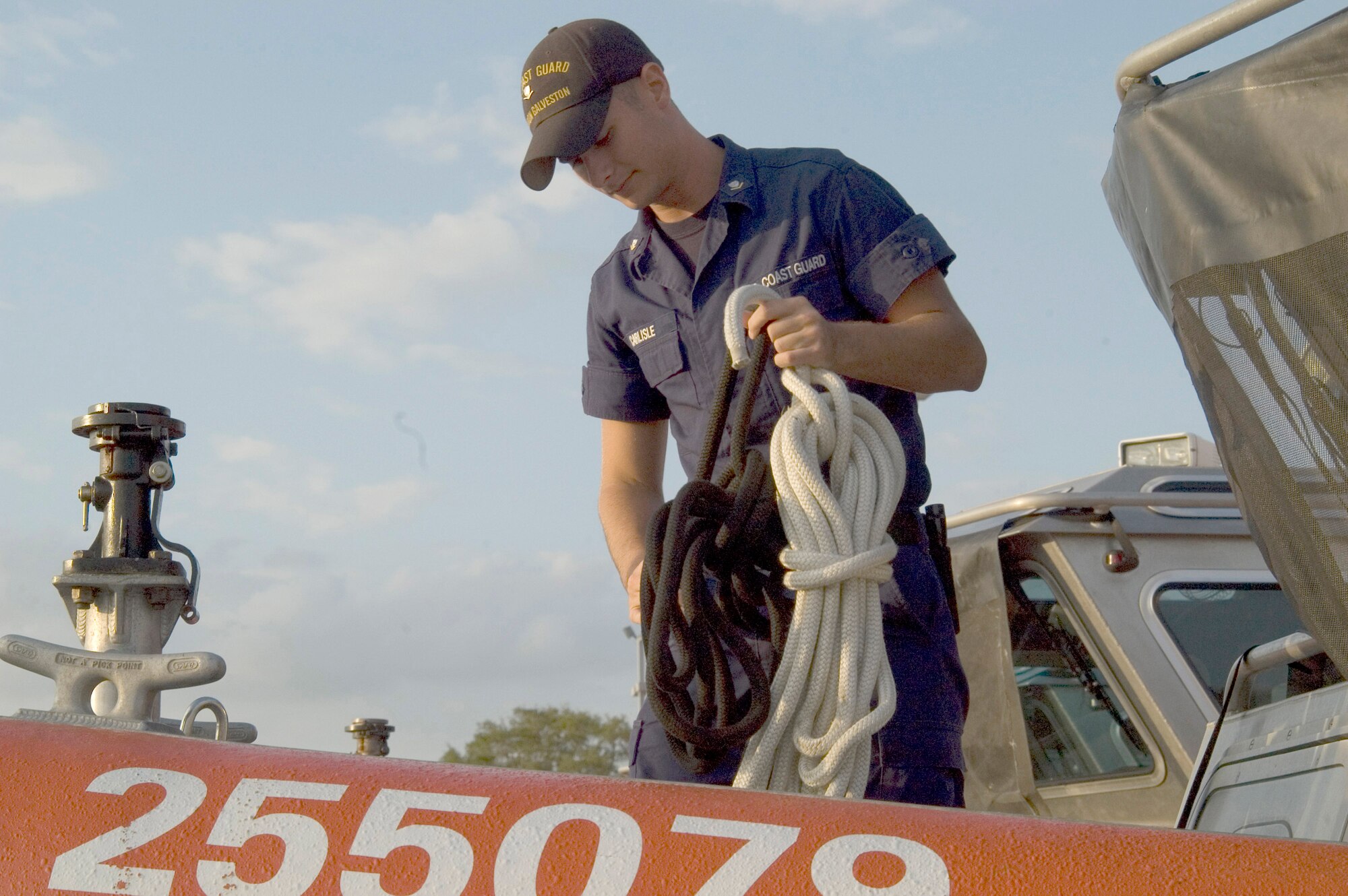 Coast Guard Petty Officer 3rd Class Ryan Carlisle prepares one of the 25-foot response boats Sept. 11 at the Leonard E. Merrell Center in Katy, Texas. Petty Officer Carlise and members of the Coast Guard Sector Houston-Galveston are preparing for the arrival of Hurricane Ike expected to hit the Gulf Coast Sept. 13. (U.S. Air Force photo/Tech. Sgt. Stacy Simon) 
