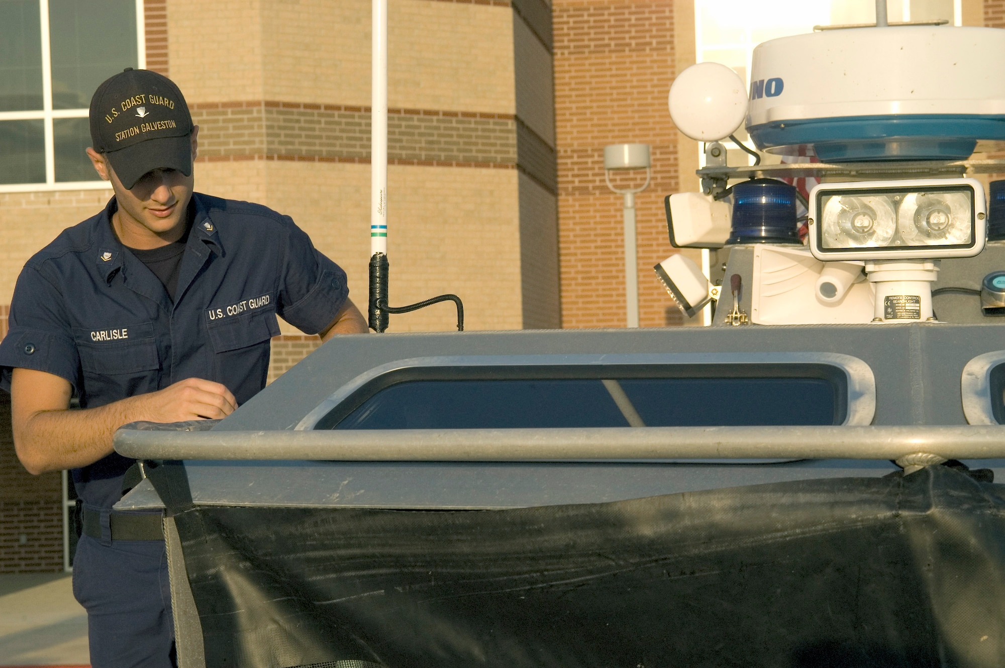 Coast Guard Petty Officer 3rd Class Ryan Carlisle prepares one of the 25-foot response boats Sept. 11 at the Leonard E. Merrell Center in Katy, Texas. Petty Officer Carlise and members of the Coast Guard Sector Houston-Galveston are preparing for the arrival of Hurricane Ike expected to hit the Gulf Coast Sept. 13. (U.S. Air Force photo/Tech. Sgt. Stacy Simon) 