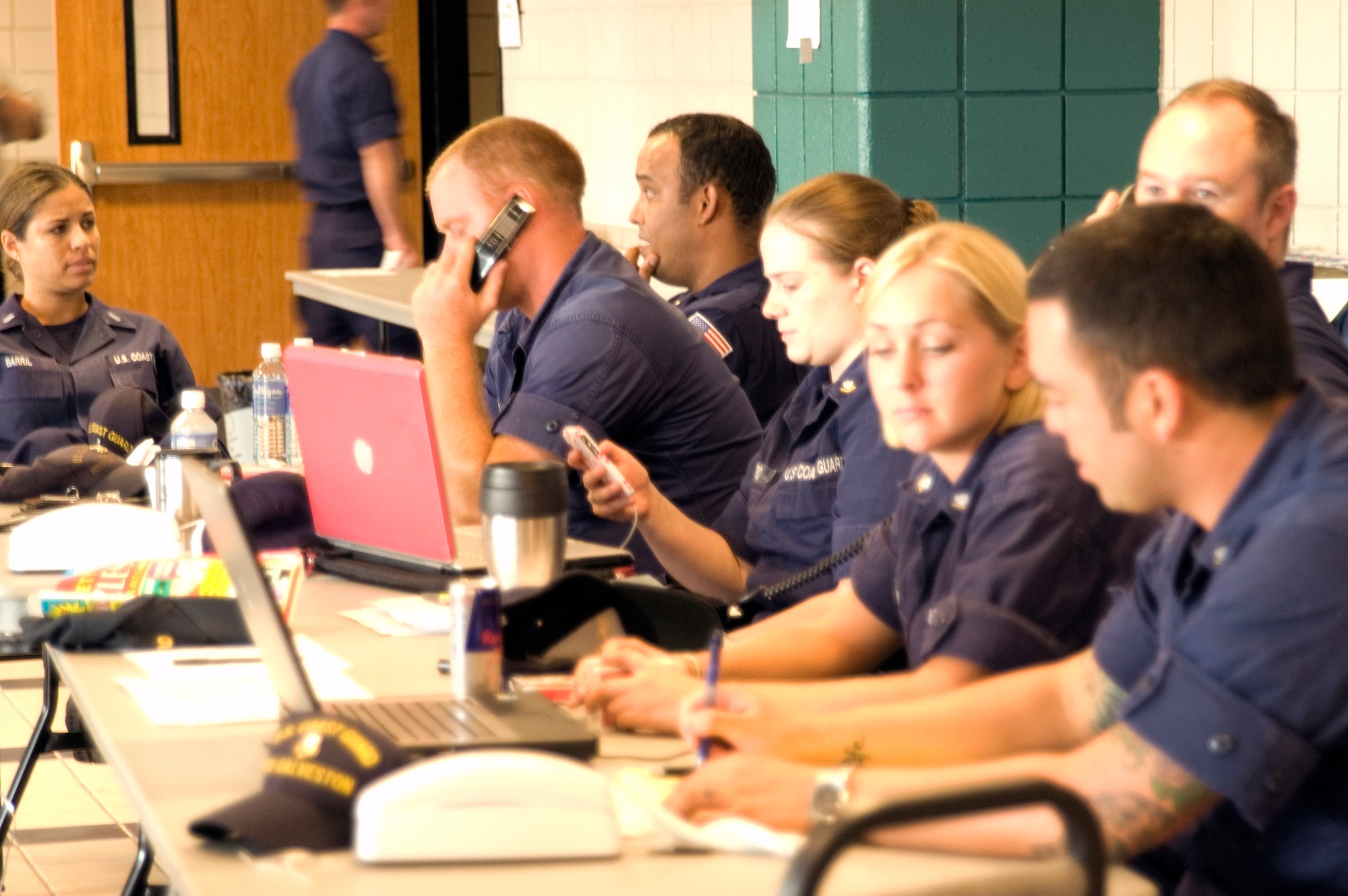 Coast Guardsmen from the Coast Guard Sector Houston-Galveston inprocess new arrivals to the Leonard E. Merrell Center Sept. 11 in Katy, Texas. The Coast Guardsmen are preparing for the arrival of Hurricane Ike expected to hit the Gulf Coast Sept. 13. (U.S. Air Force photo/Tech. Sgt. Stacy Simon)
