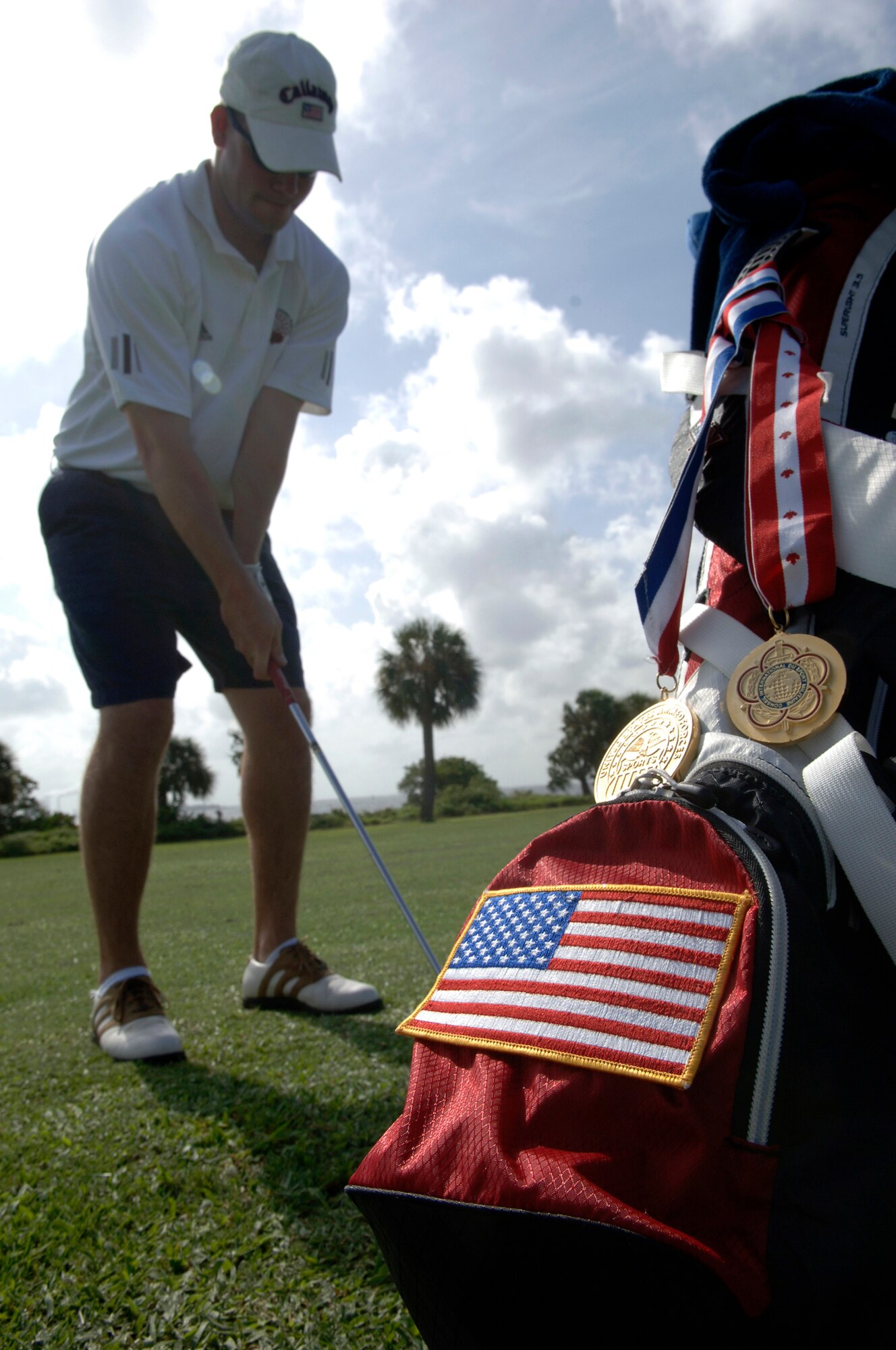 U.S. Air Force A1C John Little practices his gold swing at MacDill AFB September 02, 2008.  A1C Little has won two gold medals for the MacDill golf team.  
  (U.S. Air Force photo by Amn Kate Benoy) (Released)