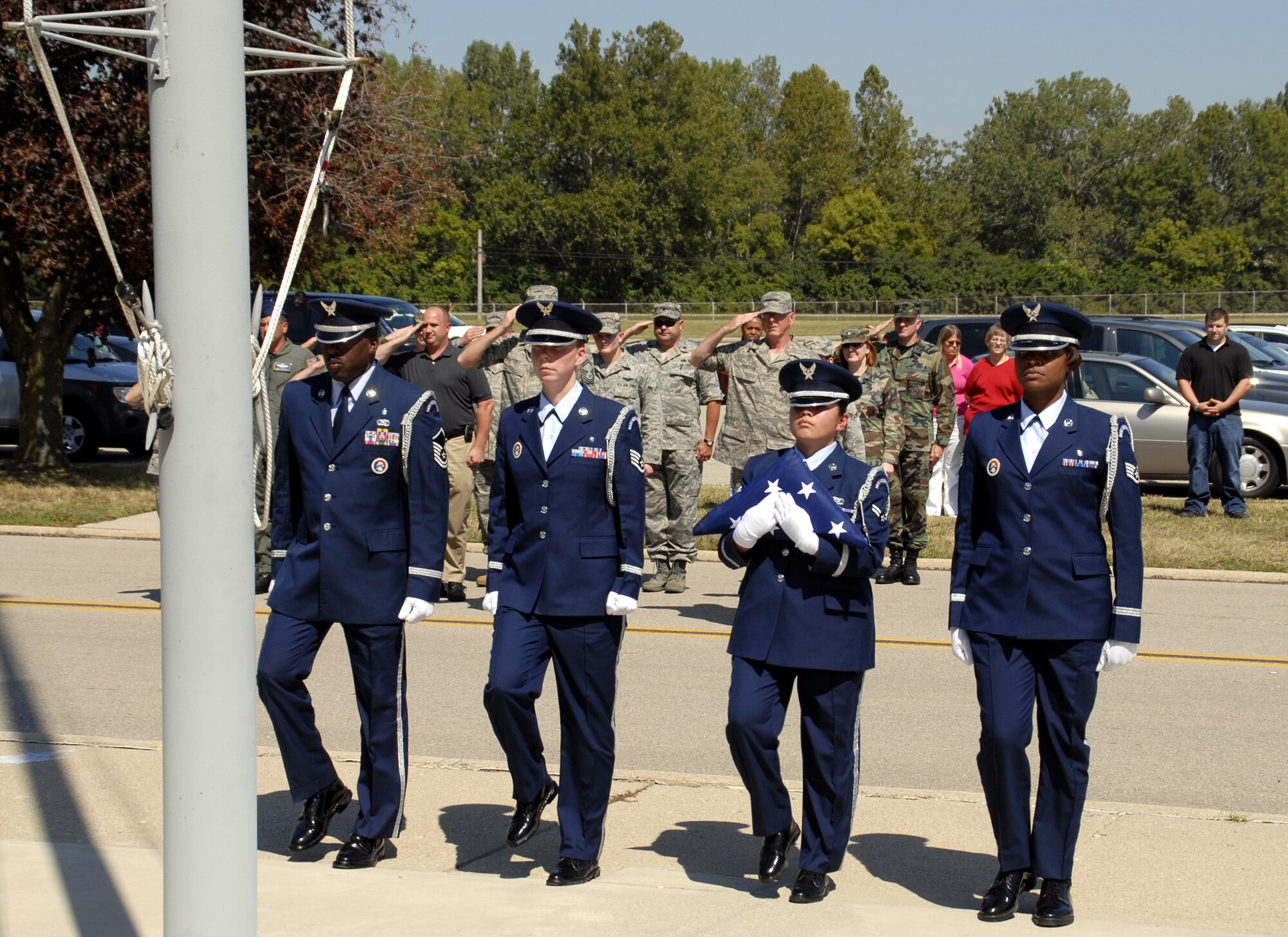 WRIGHT-PATTERSON AFB, Ohio - A joint forces Honor Guard team from the 445th Airlift Wing and Wright-Patterson AFB post the colors during a Patriot Day Ceremony at the 445th Airlift Wing.  Wing members took a few moments to remember and honor the victims of September 11, 2001, and reaffirm their commitment to the Global War on Terror. (U.S. Air Force photo/Tech. Sgt. Charlie Miller)
