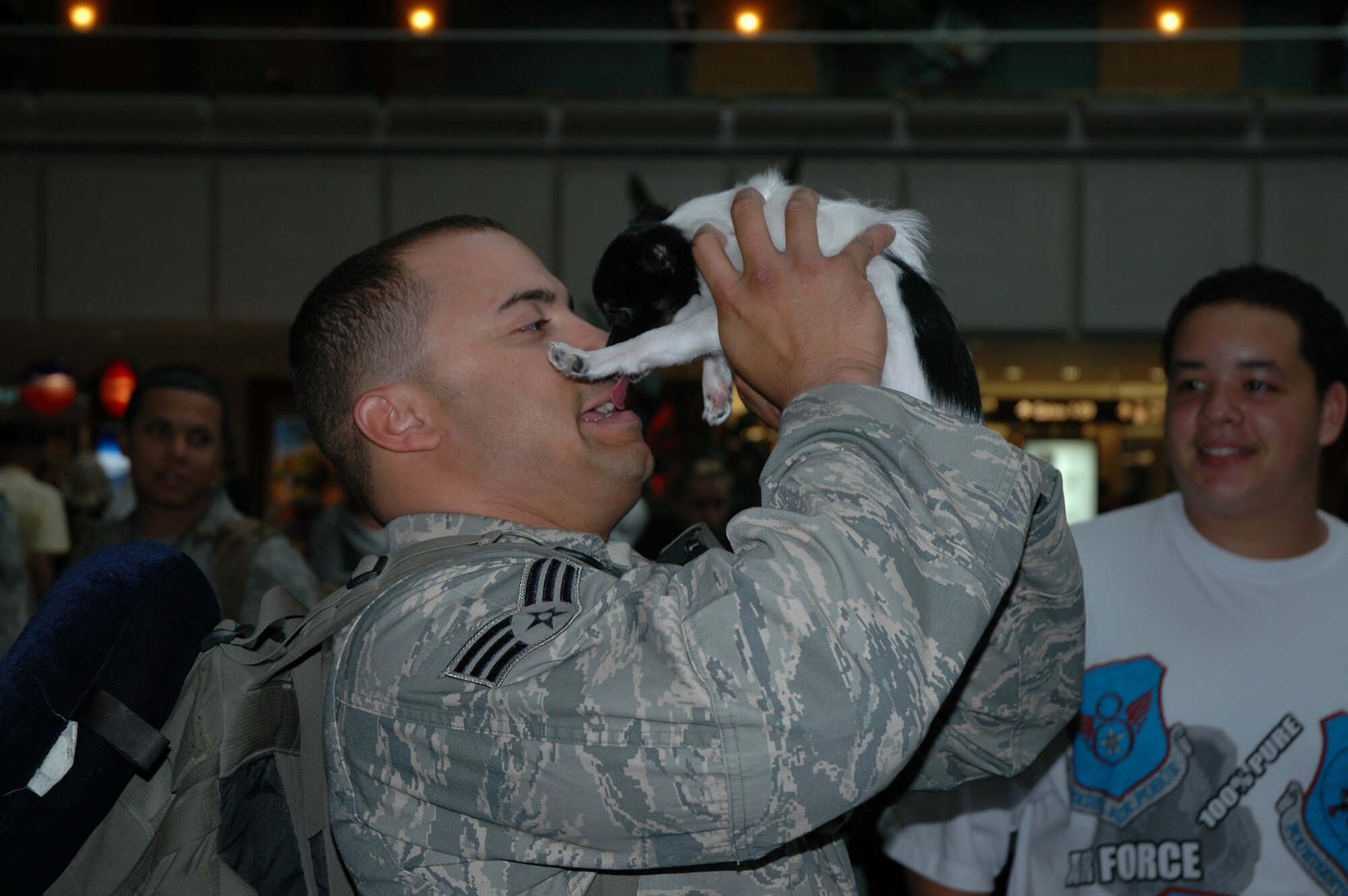 Senior Airman Lawrence Hill gets an appreciative kiss from his dog in the Orlando airport. Airman Hill was one of 10 Airmen from the 45th Security Forces Squadron who returned September 5 from a four-month long deployment to Afghanistan. “Squadron leadership is proud of Lawrence, his team, and the support they were able to provide to their leadership inside the wire and to the community outside the wire at their deployed location. They should be proud of their accomplishments, and we are glad to have them back home safe!” said Master Sgt. Anthony Hanshaw, first sergeant for the squadron. (U.S. Air Force photo by 2nd Lt. Karl Wiest)