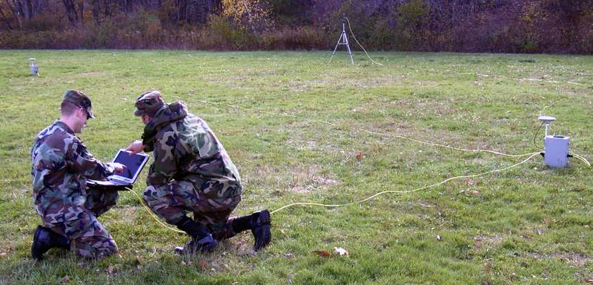 Two Airmen from the Electronic Systems Center of Hanscom Air Force Base, Mass., put together a portable contingency landing system that's carried in backpacks during Air Mobility Battlelab's Portable Contingency Landing System Initiative concept demonstration at Duke Field, Fla., in July 2008.  The initiative calls for a CLS that can bridge the gap between current precision landing systems and a future, fully-automated, on-board autonomous landing capability for military aircraft landing in remote airfields.  The portability factor helps contingency response forces who set up the contingency landing system.  (U.S. Air Force Photo)