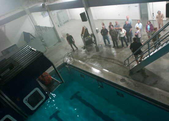 FAIRCHILD AIR FORCE BASE, Wash. – Fairchild’s Honorary Commanders witness a water survival demonstration by the 336th Training Group at the Aquatic Center here Sept. 5. The act included a mock plane crash and water rescue preformed by Survival, Evasion, Resistance and Escape specialists. (U.S. Air Force photo / Airman 1st Class Melissa Barnett)
