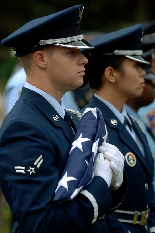 LANGLEY AIR FORCE BASE, Va. - Airman 1st Class Marshal Jones, Base Honor Guard, presents the flag during the City of Hampton Proclamation for Day of Remembrance and Hope on Sept. 11. (U.S. Air Force photo/Tech. Sgt. Levi Collins) 