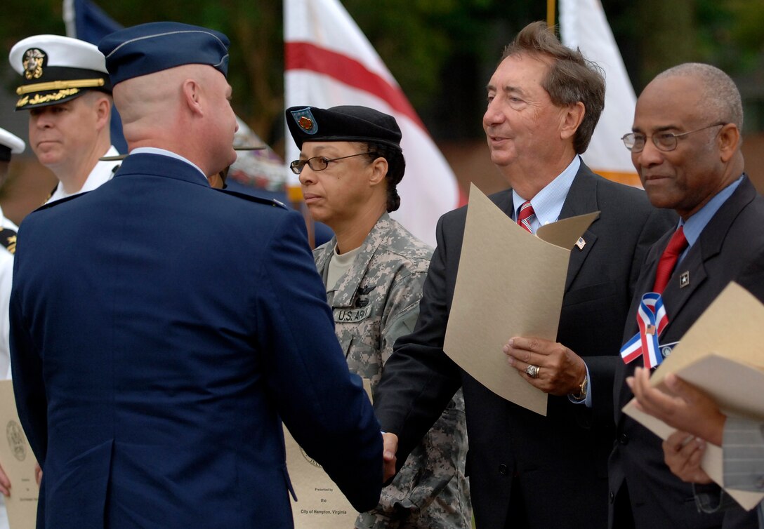 LANGLEY AIR FORCE BASE, Va. - Col. Kevin Altman, Air Combat Command, receives a City of Hampton Proclamation for the Day of Remembrance and Hope from Hampton's vice mayor, Joseph Spencer, on Sept. 11. (U.S. Air Force photo/Tech. Sgt. Levi Collins) 