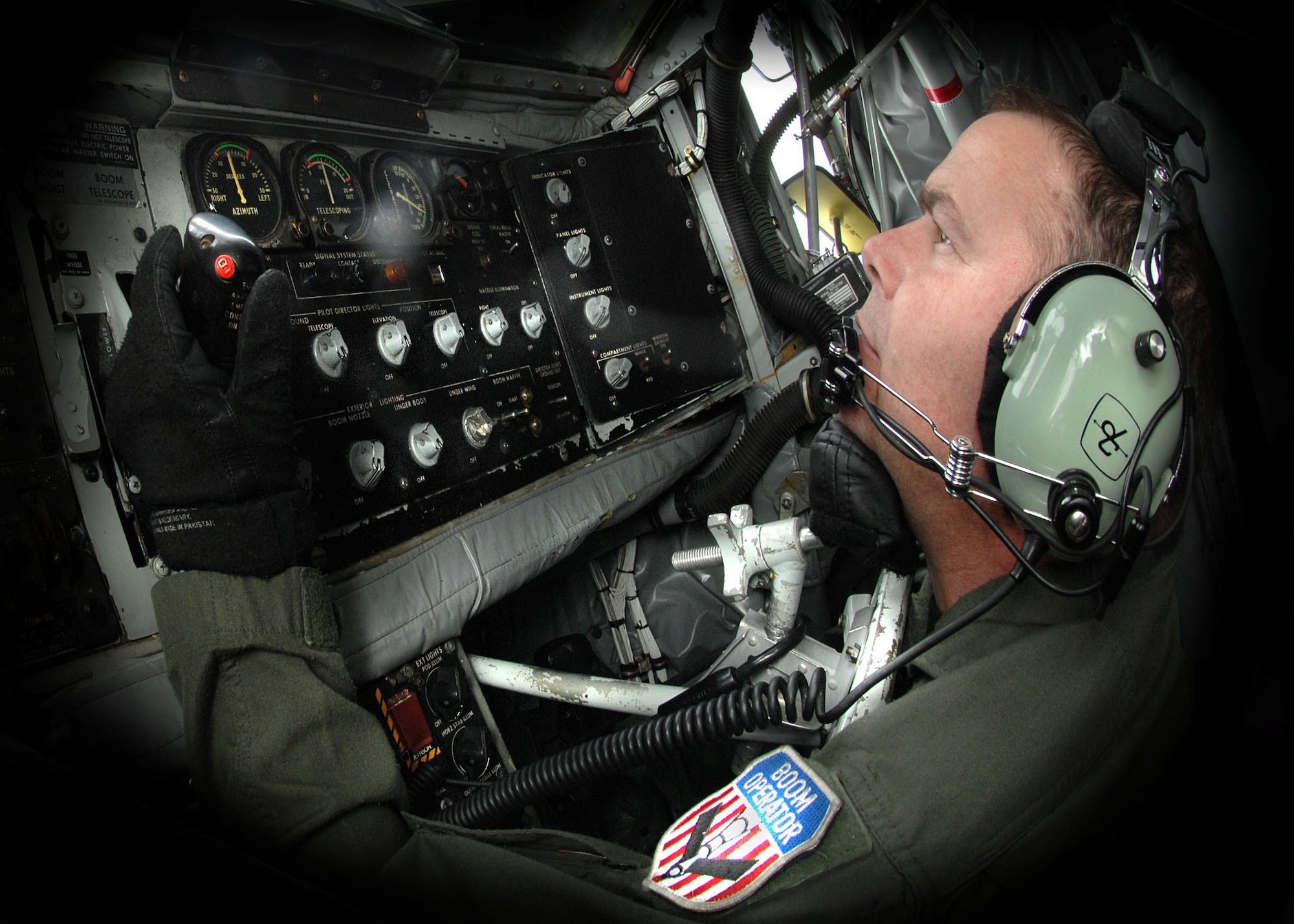 Tech. Sgt. RaileR Cantrell, 351st Air Refueling Squadron, operates the controls in the boom pod of a KC-135 Stratotanker Aug. 18 during a refueling mission on which he passed his 6,000th hour of flying time. (U.S. Air Force photo by Staff Sgt. Tyrona Pearsall)