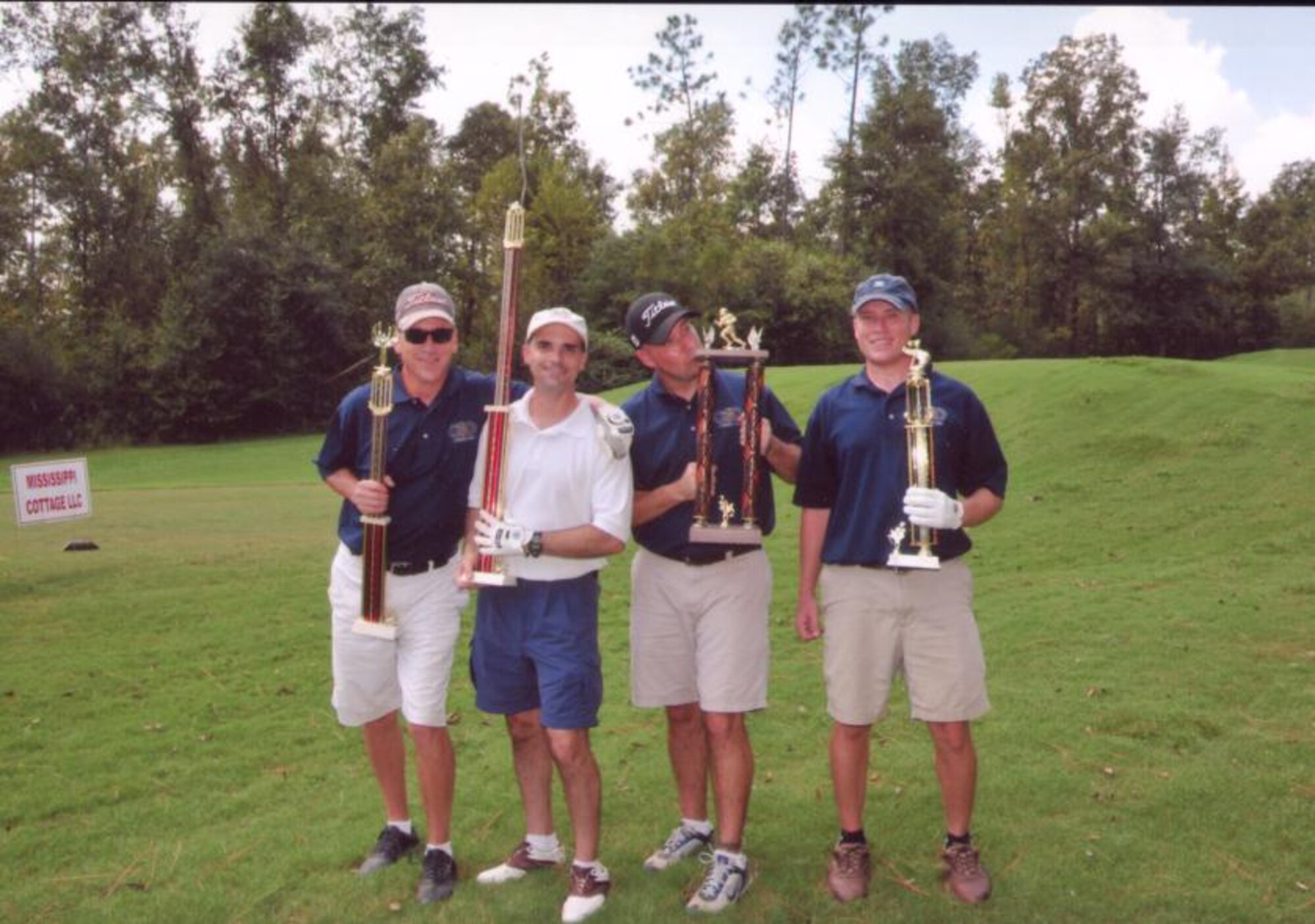 SMSgt John Geboy, Lt Col Russell Voce, TSgt Matthew Jones, SSgt Lawrence Snyder celebrate the 336 TRS raising over $600.00 for The Ricky Peden Make-A-Wish® Golf Tournament, which was held at The Oaks Golf Club in Pass Christian on Friday, September 5th. Twenty-one teams joined in the event that honors the memory of Ricky Peden, raising over $20K total.  This event helped raise funds to grant the wishes of South Mississippi children between the ages of two and a half to eighteen years of age, who have been diagnosed with a life-threatening medical condition.  (Courtesy photo)