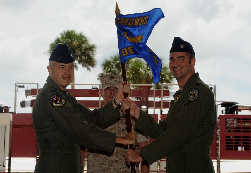 MOODY AIR FORCE BASE, Ga. – Col. Kenneth Todorov, 23rd Wing commander, passes the guidon to Lt. Col. Charles MacLaughlin, incoming 23rd Wing Detachment 1 commander, during an assumption of command ceremony Sept. 11 at the Avon Park Air Ground Training Complex at MacDill AFB, Fla. Lt. Col. MacLaughlin is coming from Hollman AFB, N.M. (U.S. Air Force photo by Senior Airman Gina Chiaverotti)