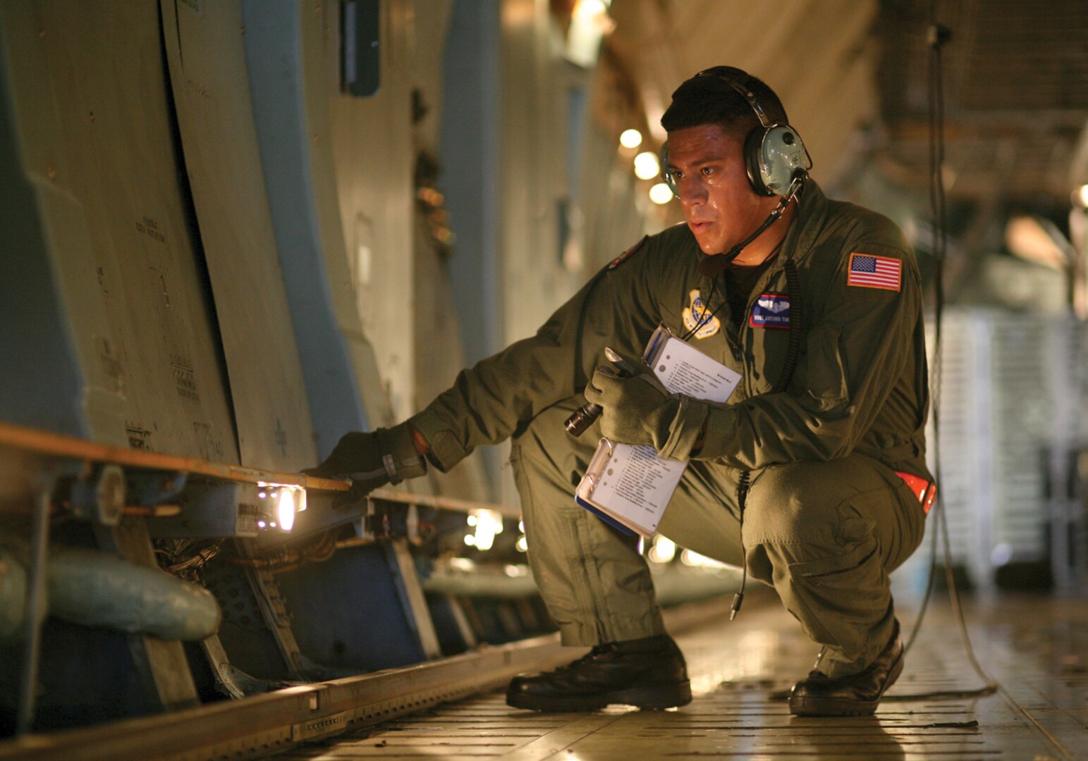 9/12/2008 - Staff Sgt. Antonio Torres performs a preflight check of a C-5 aircraft before take off. Sergeant Torres is a flight engineer with the 433rd Airlift Wing, Lackland Air Force Base, Texas. .(USAF photo by Robbin Cresswell)