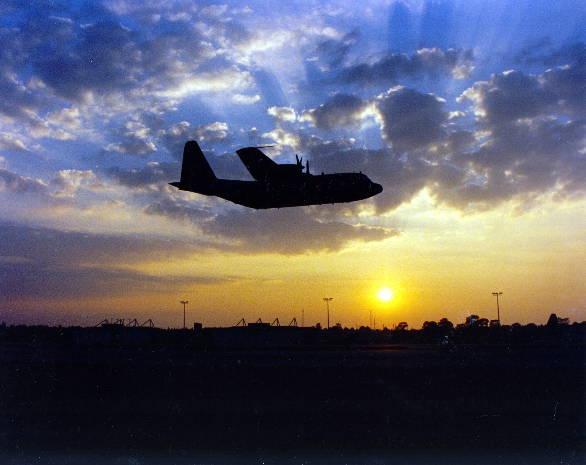 This file photo captures the final flight of the “First Lady,” the first production model AC-130A Gunship, flying over Duke Field Sept. 28, 1995. The “First Lady” arrived on Duke Field in 1975, having already celebrated her 20th anniversary. The wing’s aircraft were retired in 1995 to welcome in the wing’s new MC-130E Combat Talon I and MC-130P Combat Shadow missions. The “First Lady” now rests on the grounds of the Air Force Armament Museum near Eglin Air Force Base, Fla. (U.S. Air Force Photo/Master Sgt. Ricardo Clifton)