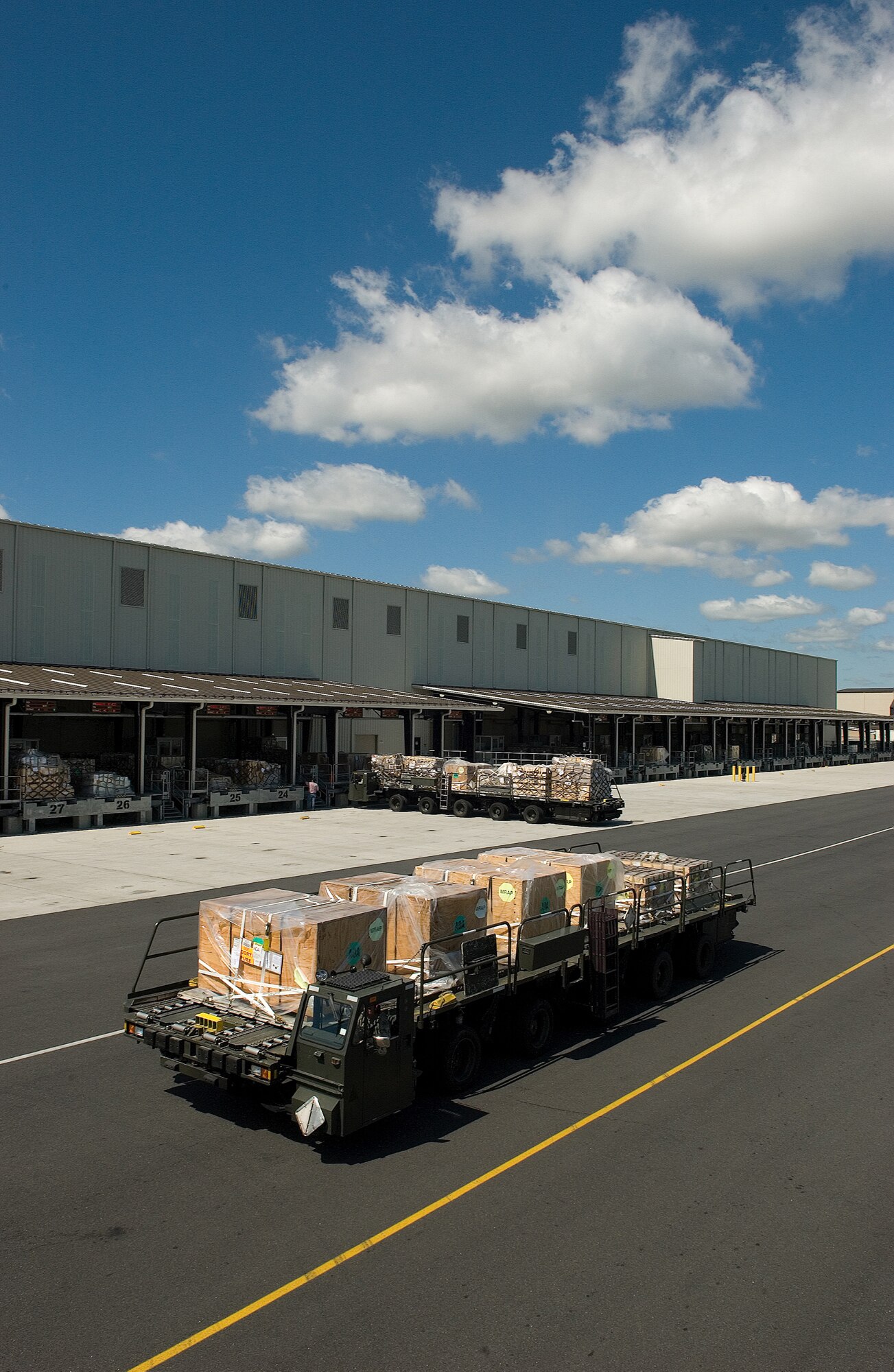 DOVER AIR FORCE BASE, Del. – A K-loader filled with pallets waits to be driven out to an aircraft Aug. 20 behind Building 505. Members of the 436th Aerial Port Squadron palletize cargo and load it onto aircraft which fly the supplies wherever they are needed worldwide. (U.S. Air Force photo/Jason Minto)